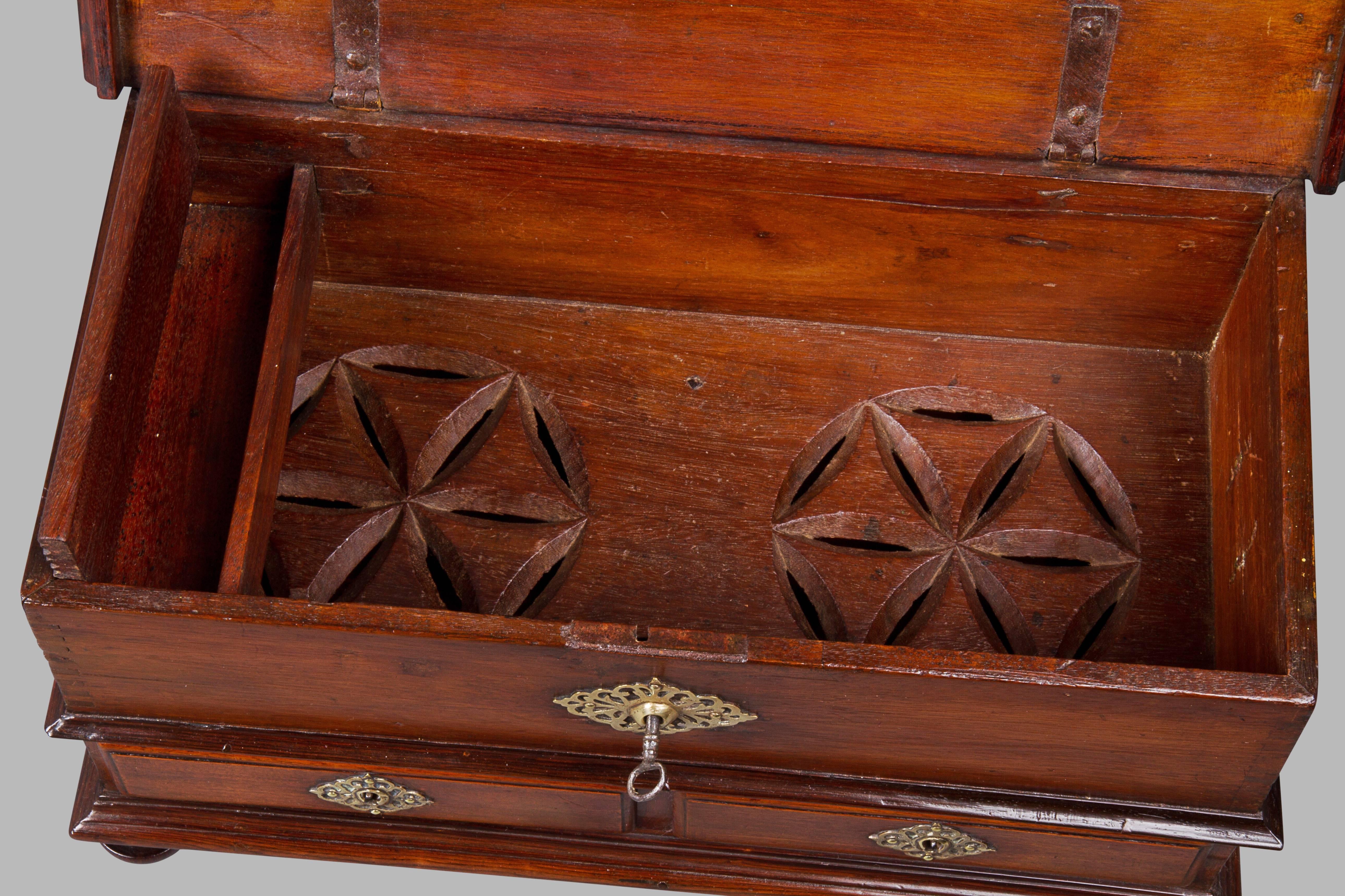 In mahogany and goncalo alves with original brass mounts, handles and lock. The interior of the chest retains the till and has the unusual feature of decorative vents to the floor to enable air circulation. An identical but full size example was