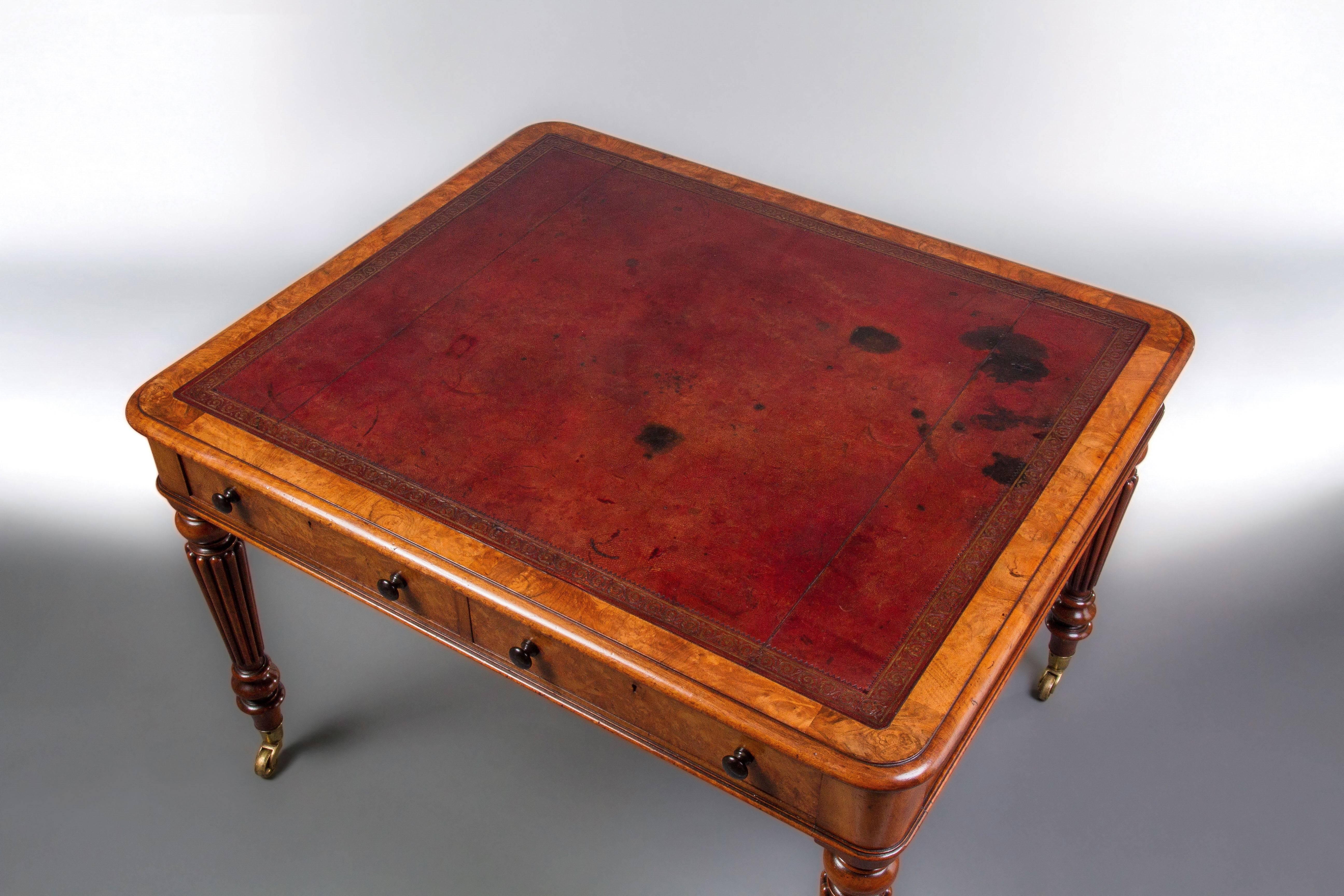 The rectangular top inset with the original gold tooled red leather above two drawers to each side, the trademark boldly ribbed legs terminating in brass caps and casters. Two drawers stamped Gillows. A Fine writing table of attractive
