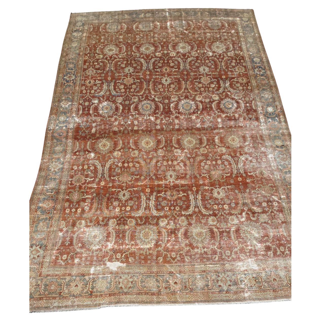 Embrace the timeless beauty of Persian craftsmanship with this antique Sultanabad rug, a striking piece handwoven in the late 19th century. Measuring 18 x 12 feet, this rug exemplifies the grandeur and artistry associated with Sultanabad weaving