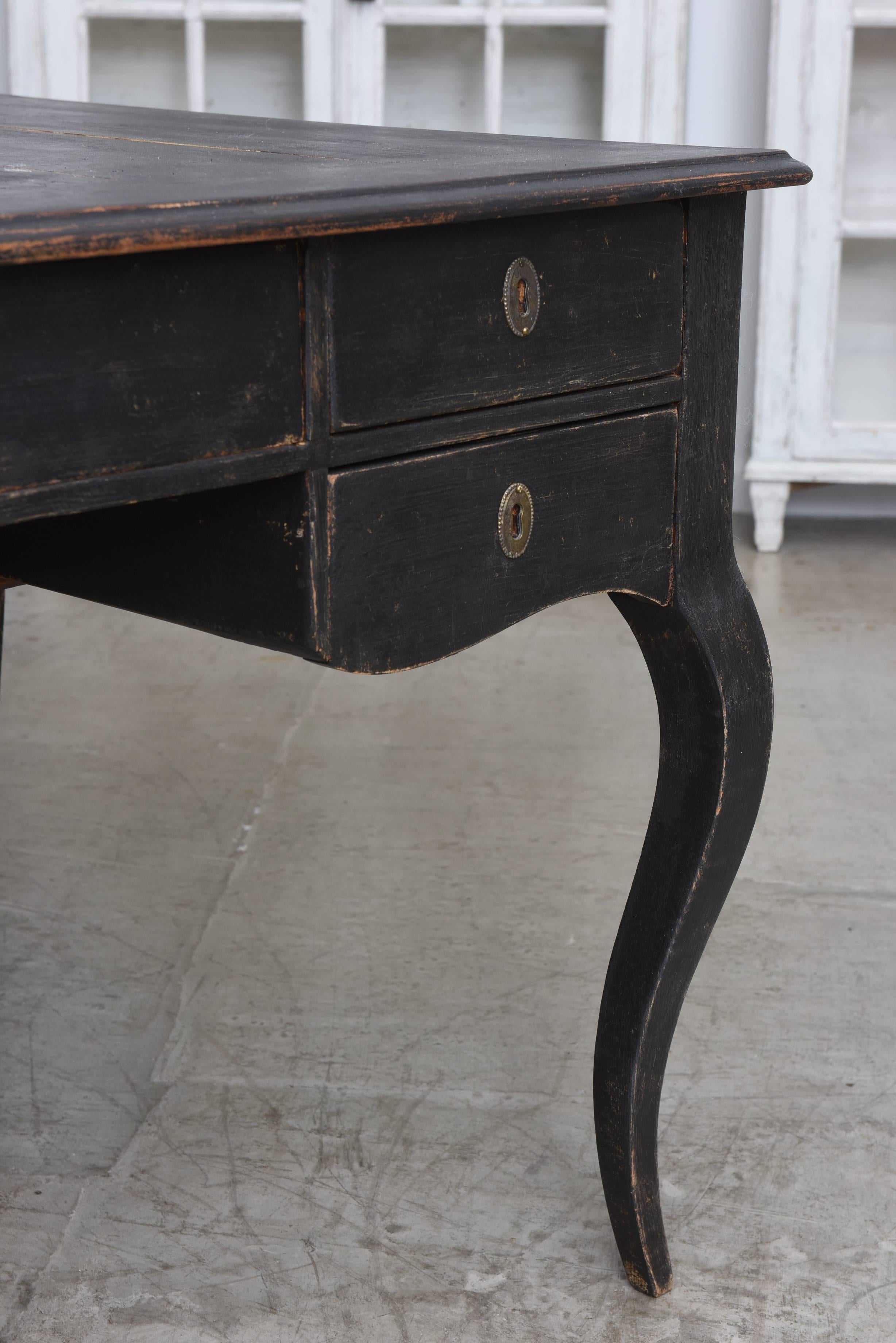 Antique Swedish partner writing desk early 19th century refreshed in the original 
black color.
The desk has beautiful Rococo style legs; and is finished on both sides with five drawers and locks and keys.
The desk is second period of Swedish