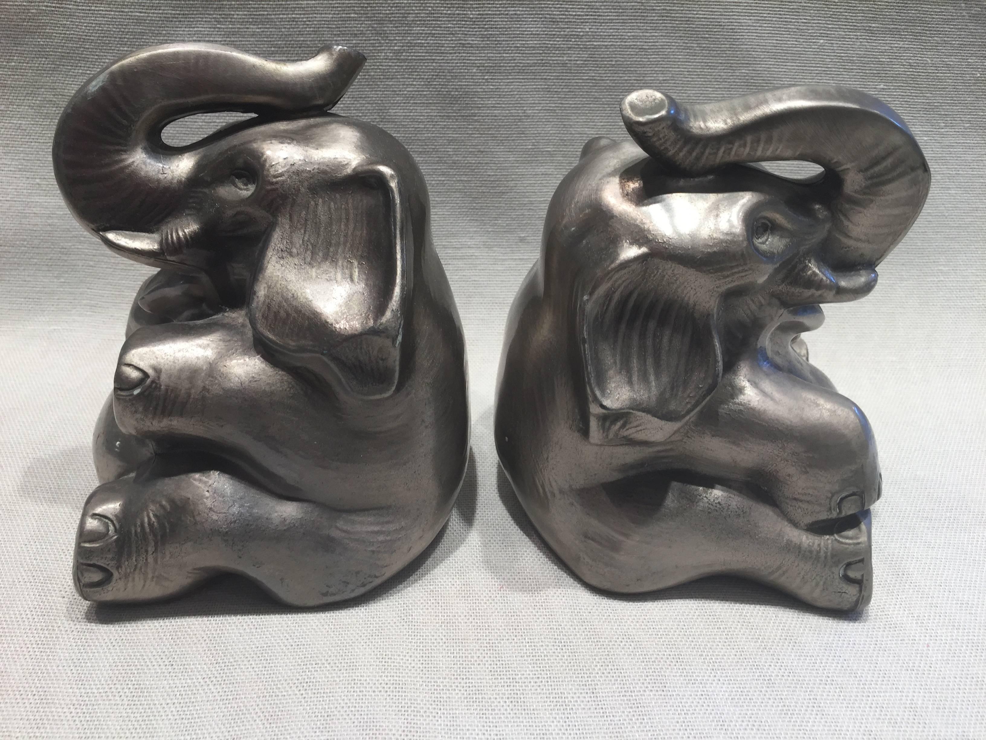 Pair of Art Deco silver finish tusk up good luck trunk Elephant bookends, lovely condition and adorable.
