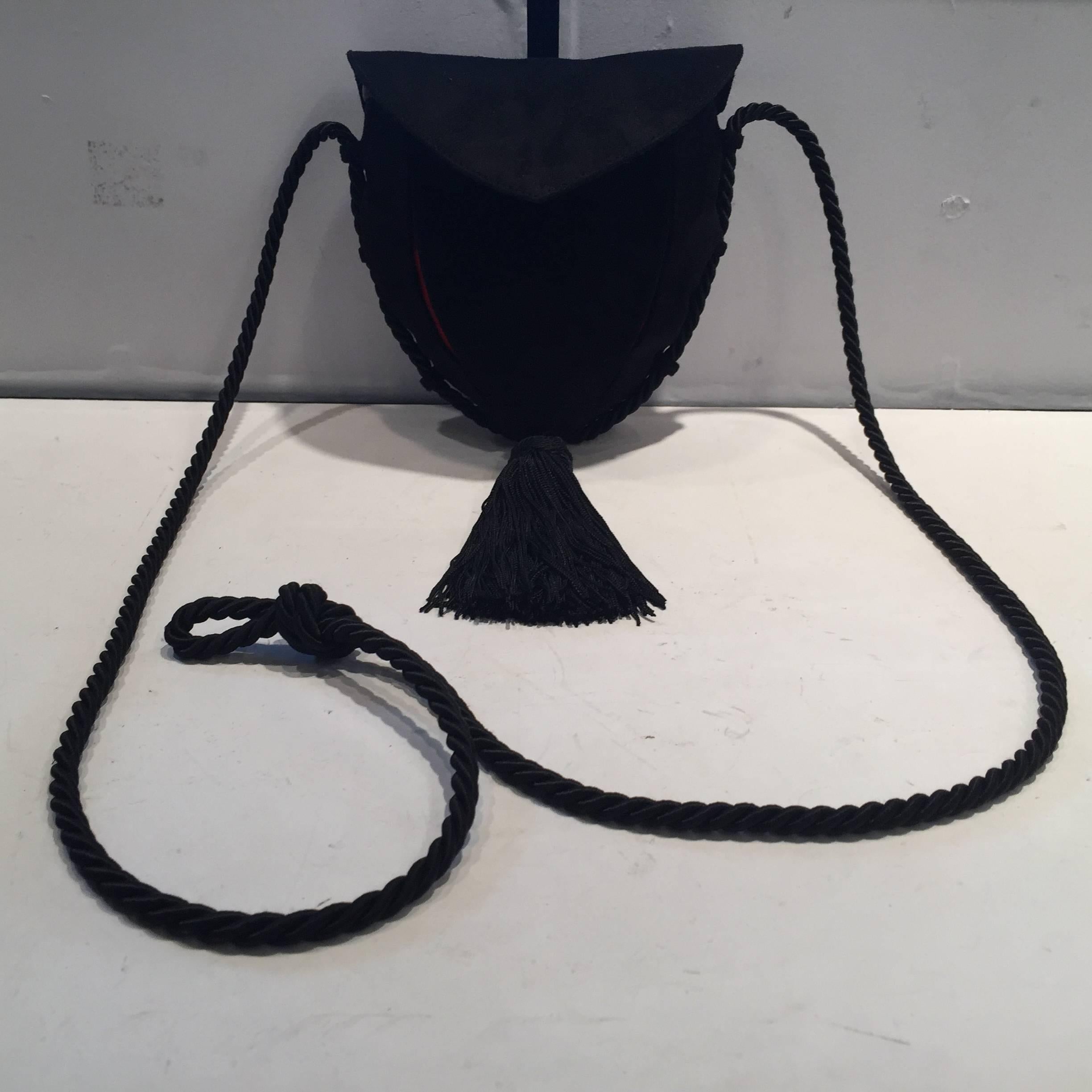 Harry Winston "Rare" black and red suede, petite leather trim, silk cord, with handmade tassel, interior embossed stamp in gold Harry Winston. 

The measurement below is just for the purse size 12'' top of purse to bottom of tassel and