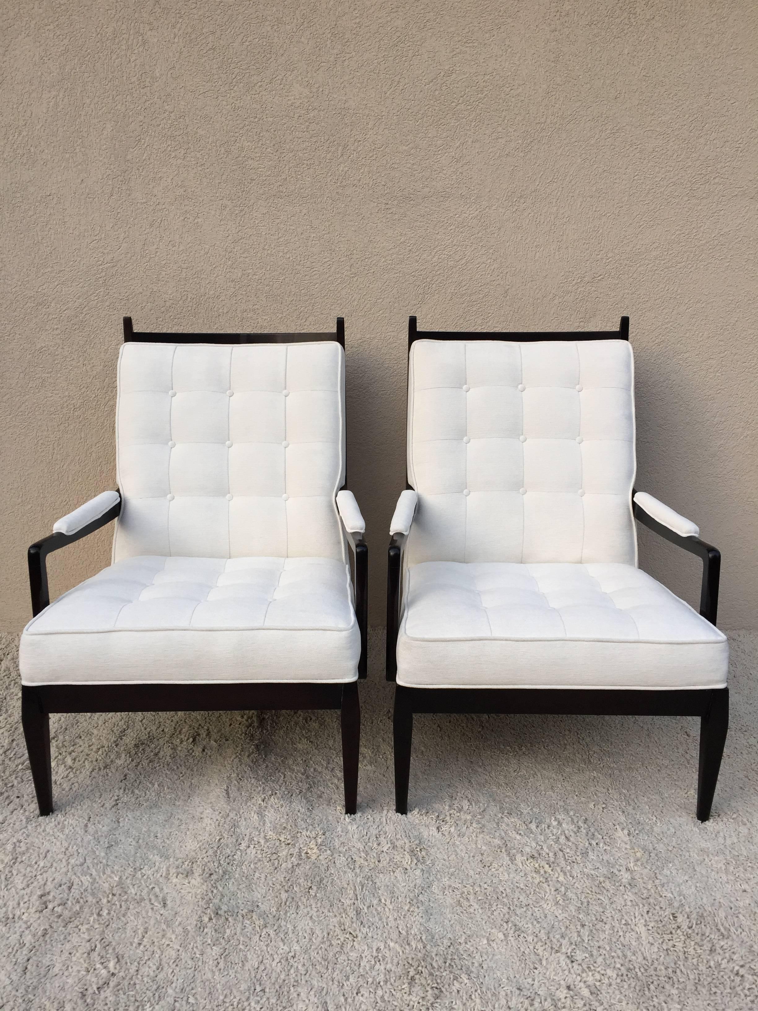 Pair of elegant high back chairs, dark walnut hand rub finish, with tufted square button back and seat, upholstery off white velvet chenille, curved top finial design.