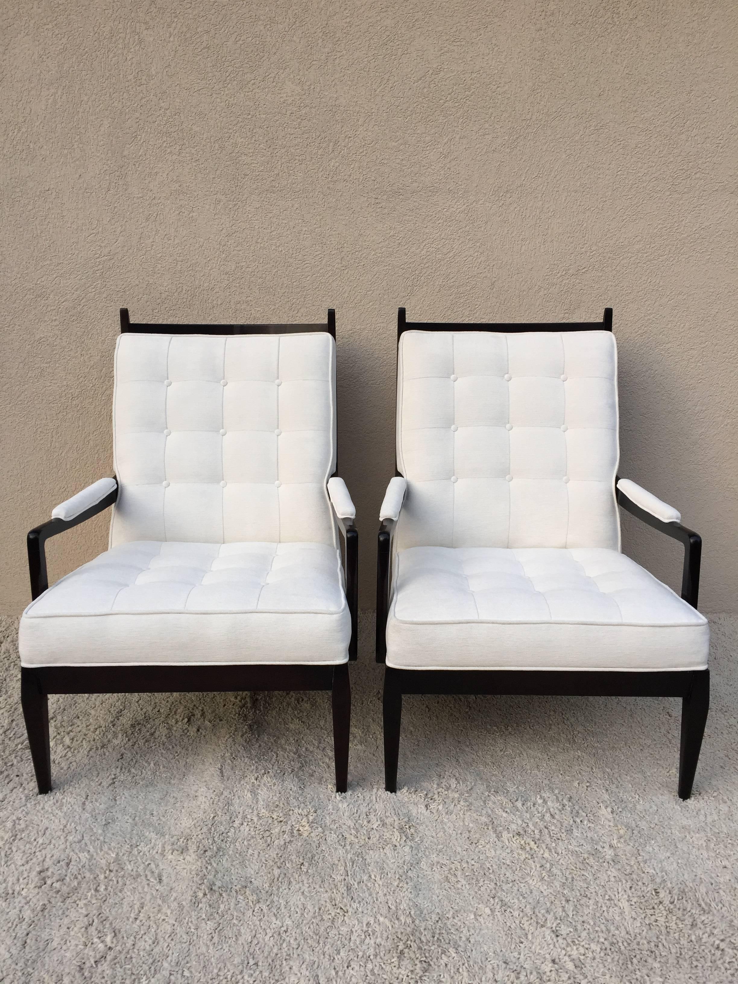 Pair of elegant high back chairs, dark walnut hand rub finish, with tufted square button back and seat, upholstery off white velvet chenille, curved top finial design.