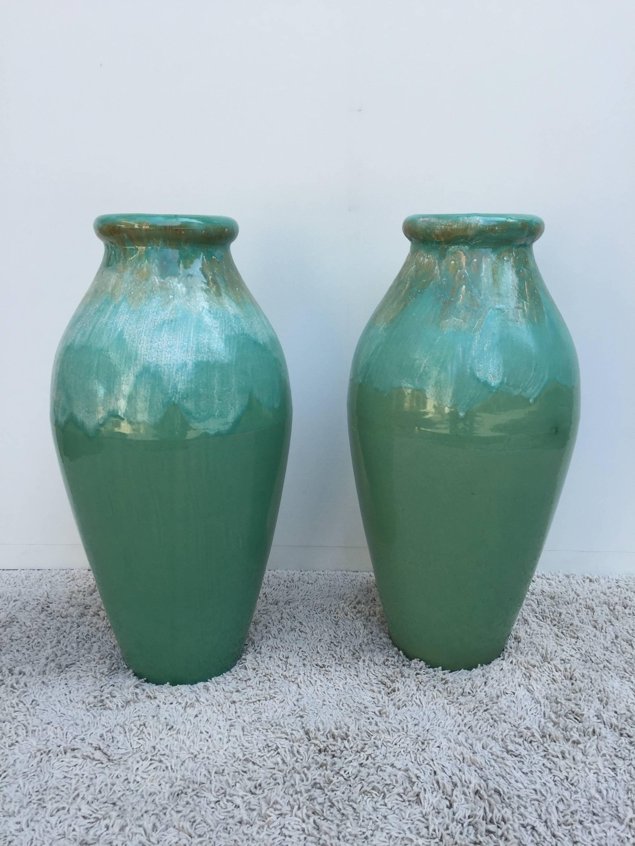 Pair of extra large Roseville Co ceramic jardiniers hand glazed and custom-made stamped Roseville USA RRP Co, on bottom. Beautiful two tone turquoise and beige/creme glaze finish.