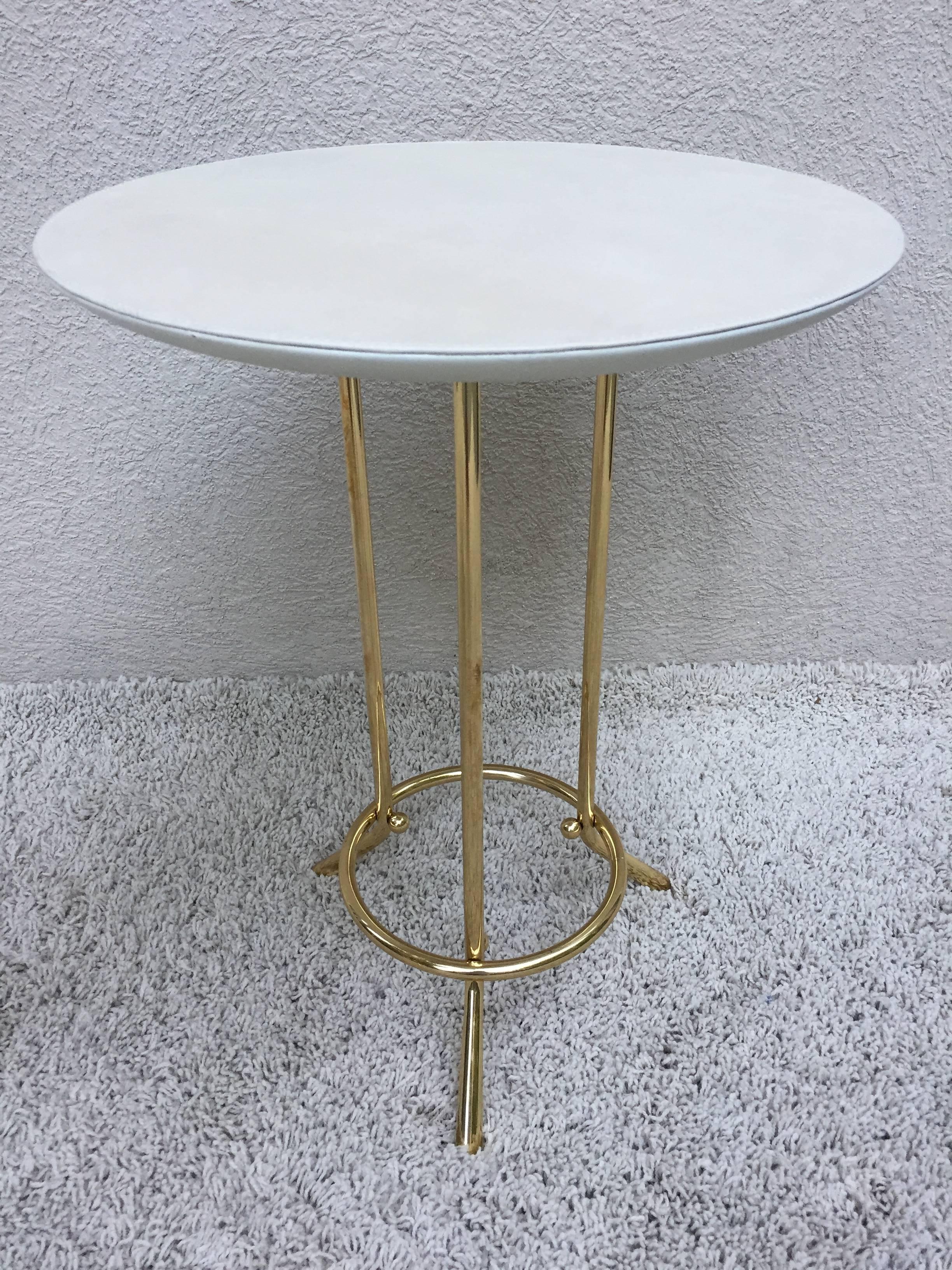 Pair of Cedric Hartman attributed/style tables, in solid brass base, with off-white leather/tops top quality construction and condition.