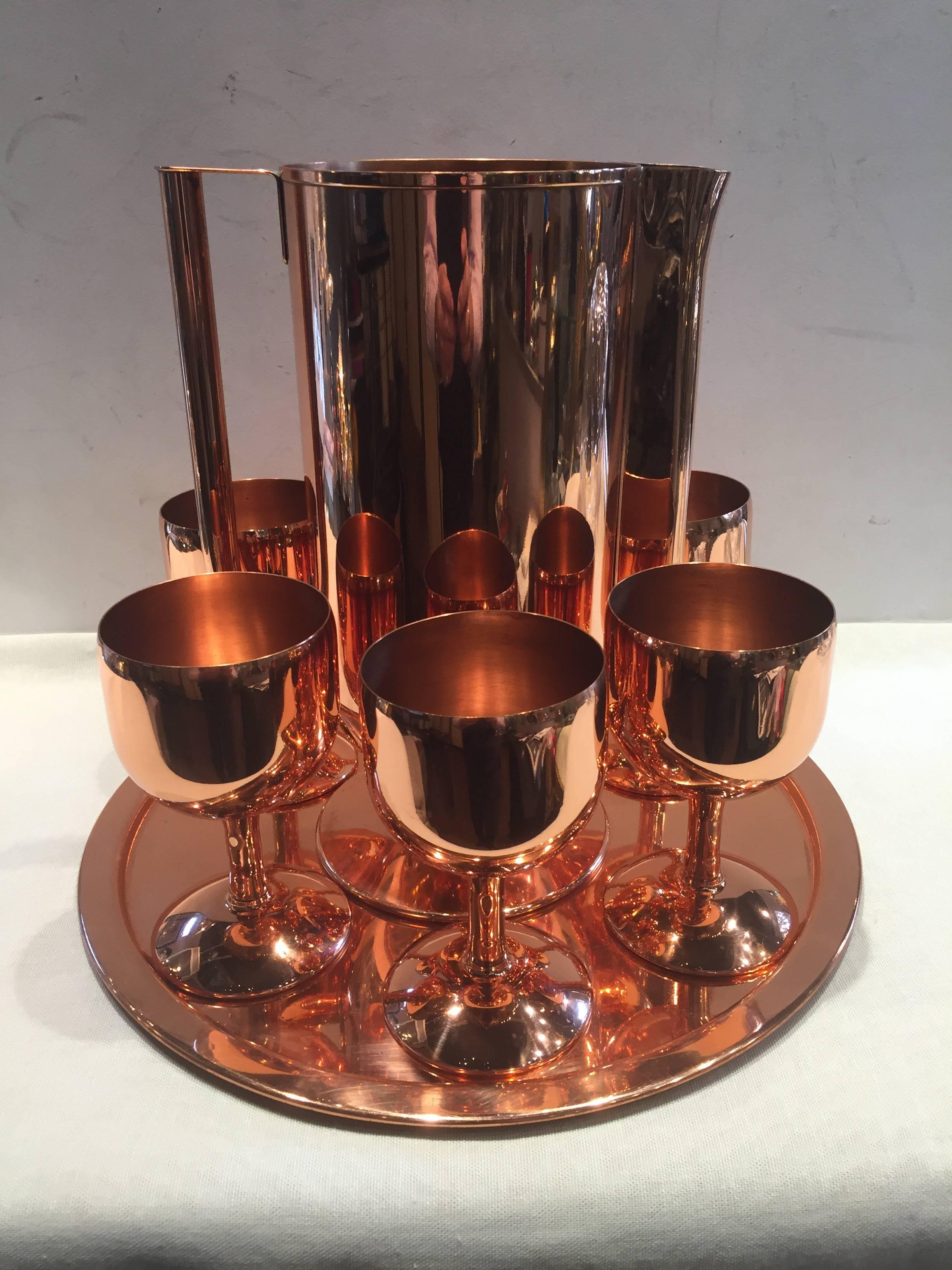 Norman Bel Geddes copper cocktail, drinks pitcher, with tray and six footed drinks cups, Art Deco.