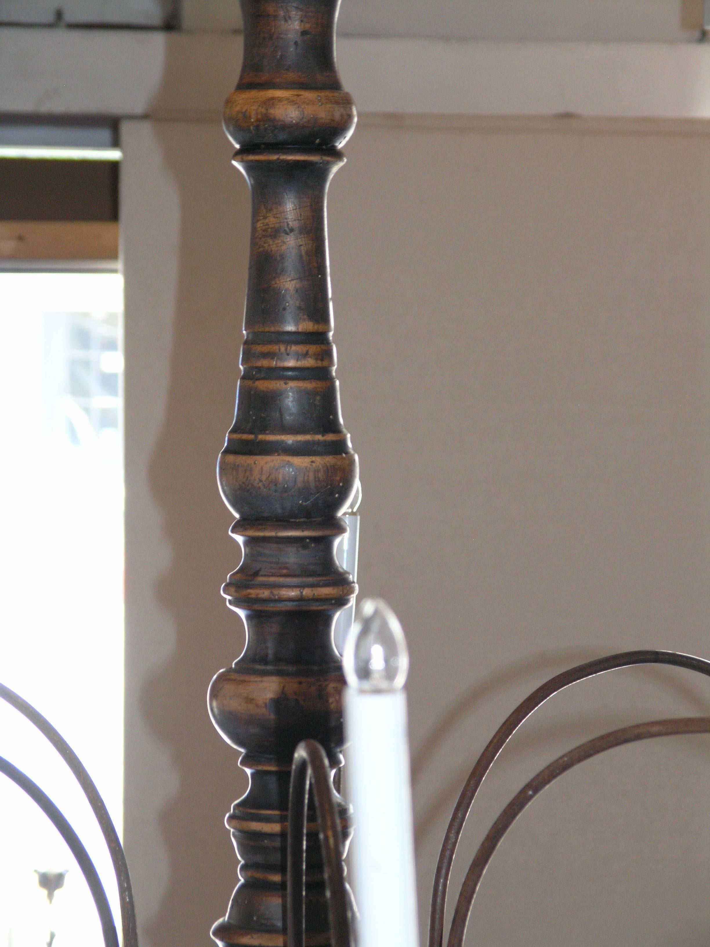Tuscan chandelier composed of 19th century and later elements. 
 baluster standard issuing six tole scrolling arms  