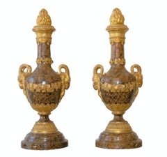 Pair of Monumental Giltwood and faux marble Urns