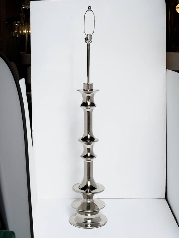 Polished Pair of Hollywood Regency Sculptural Floor Lamps in Nickel For Sale