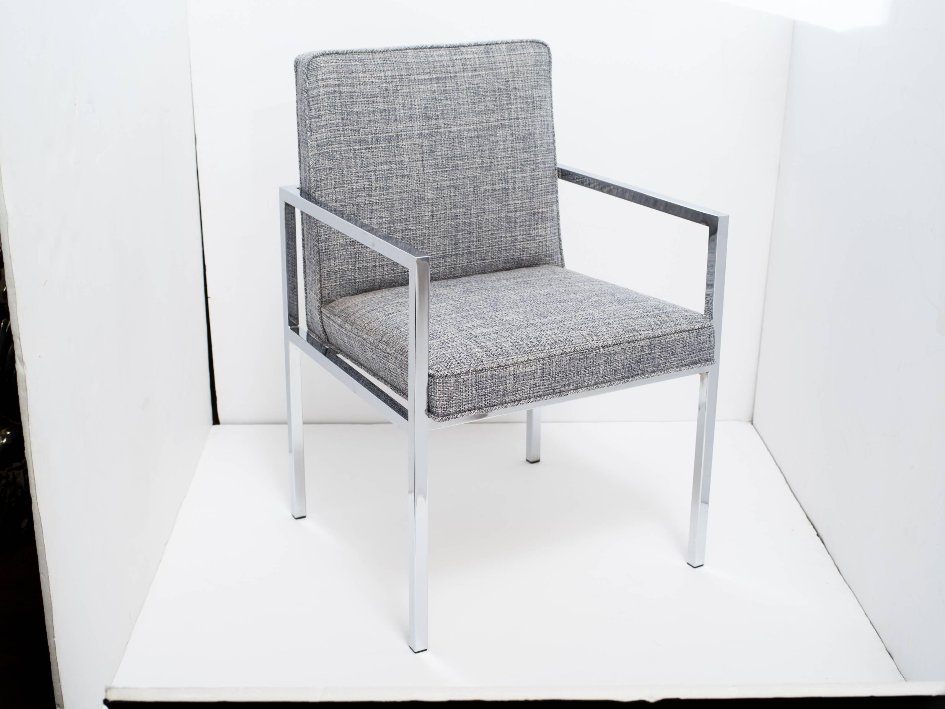 Handsome mid-century desk chair or side chair with sleek cantilevered chromed frame.  Newly upholstered in woven Rogers & Goffigon fabric in hues of steel blue and grey heather (cotton/linen).  There are two chairs available and sold separately.  