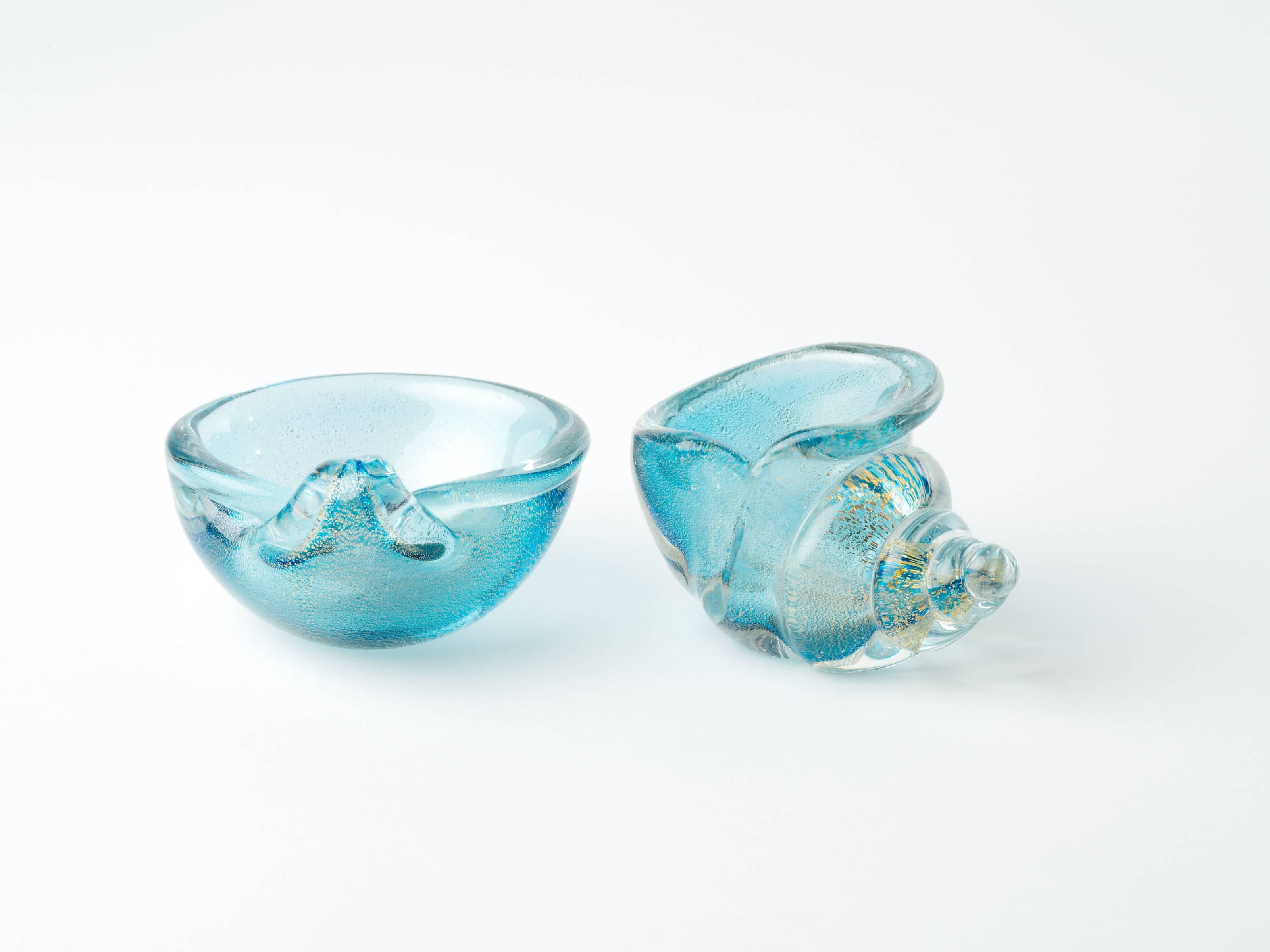 Pair of Mid-Century Modern Murano glass bowls in hues of aqua with 24-karat gold leaf flecks. Bowls have elegant shell forms with scrolled rims. Decorative or can be used a salt cellars.
