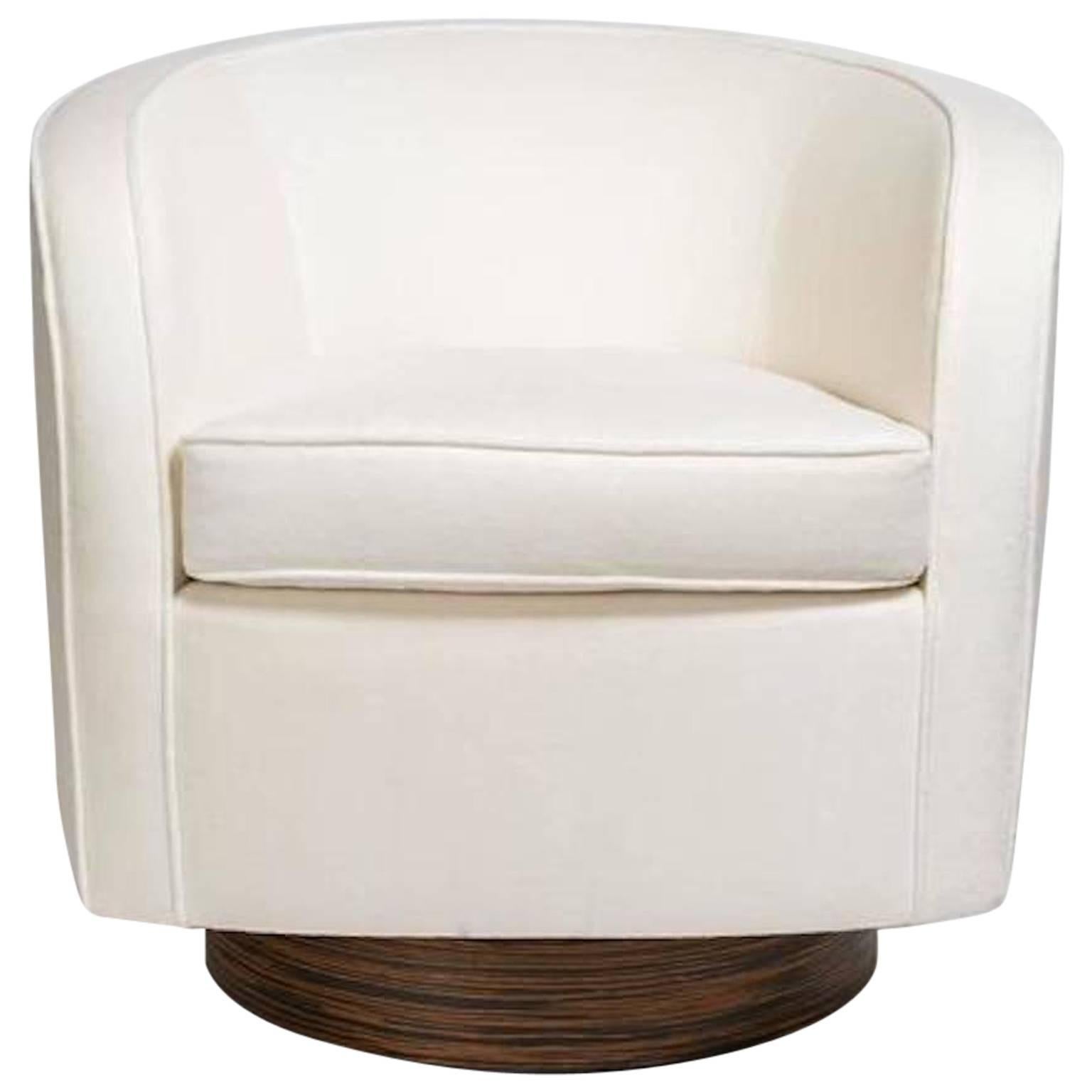 Mid-Century Modern chair with streamline barrel back design. Shown in luxurious ivory velvet fabric with self welt details. This exact fabric may not be available but we can provide a similar fabric or use customer's own fabric (COM) at no