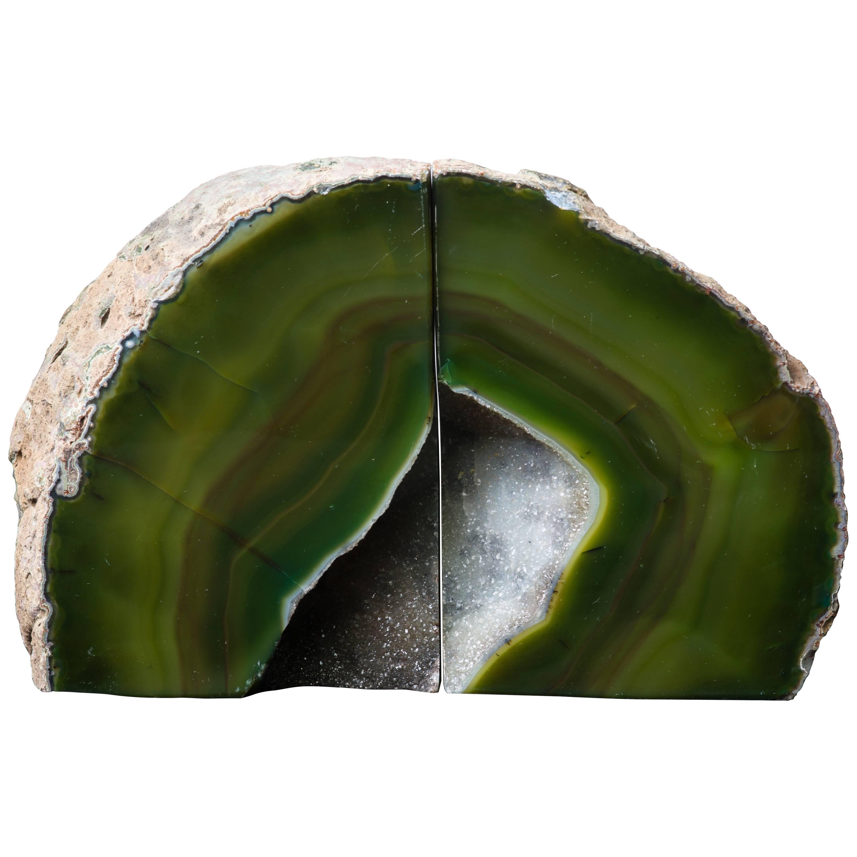 Stunning pair of chunky organic modern specimens. Handcut agate stone with rock quartz crystalline centers. Polished front and sides with natural raw edges. In striped hues of moss green, olive, and brown. Elegant shelf and desk accessories, and