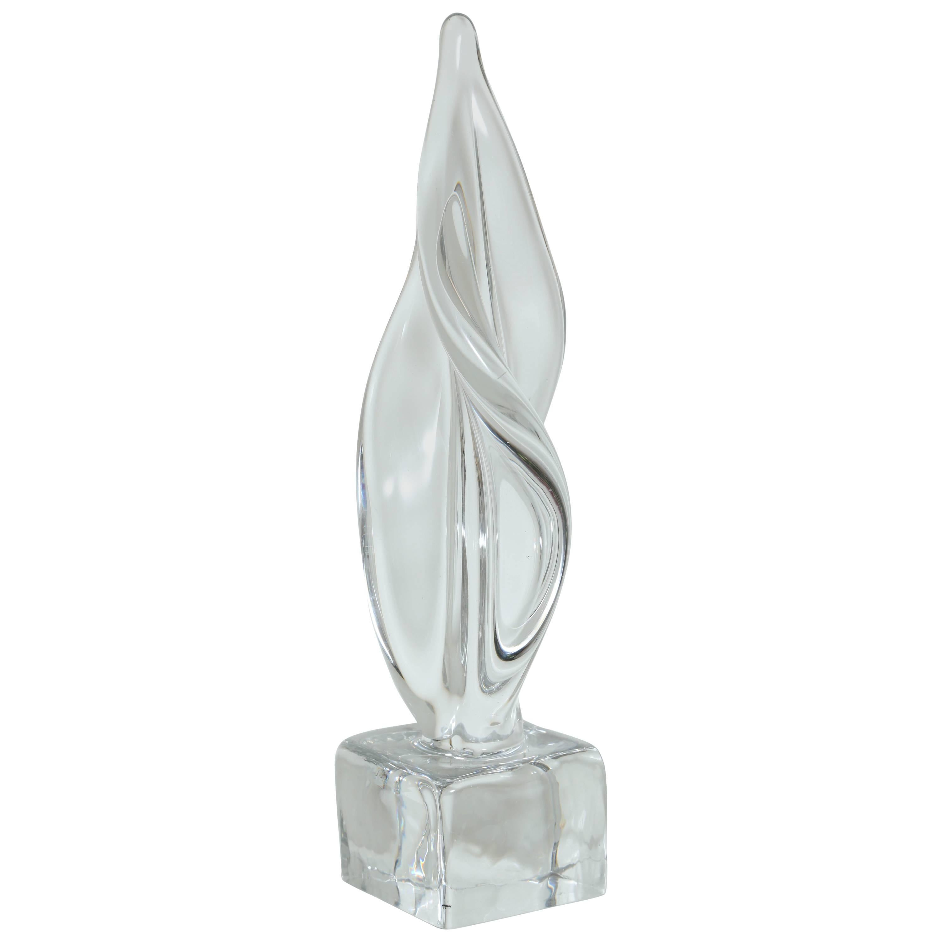 Mid-Century Modern large abstract sculpture in hand blown clear cast Murano glass. Sculpture has spiral form with amorphous design reminiscent of a fire flame, and features square solid glass pedestal base.