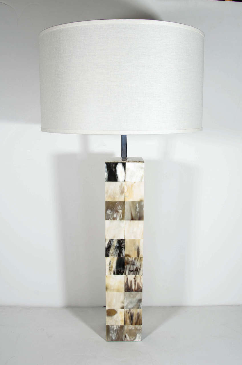 Mid-Century Modern lamp in genuine bone. Column design comprised of inlaid Horn squares in hues of ivory, grey, black, brown and camel. Features a chrome stem and newly rewired.