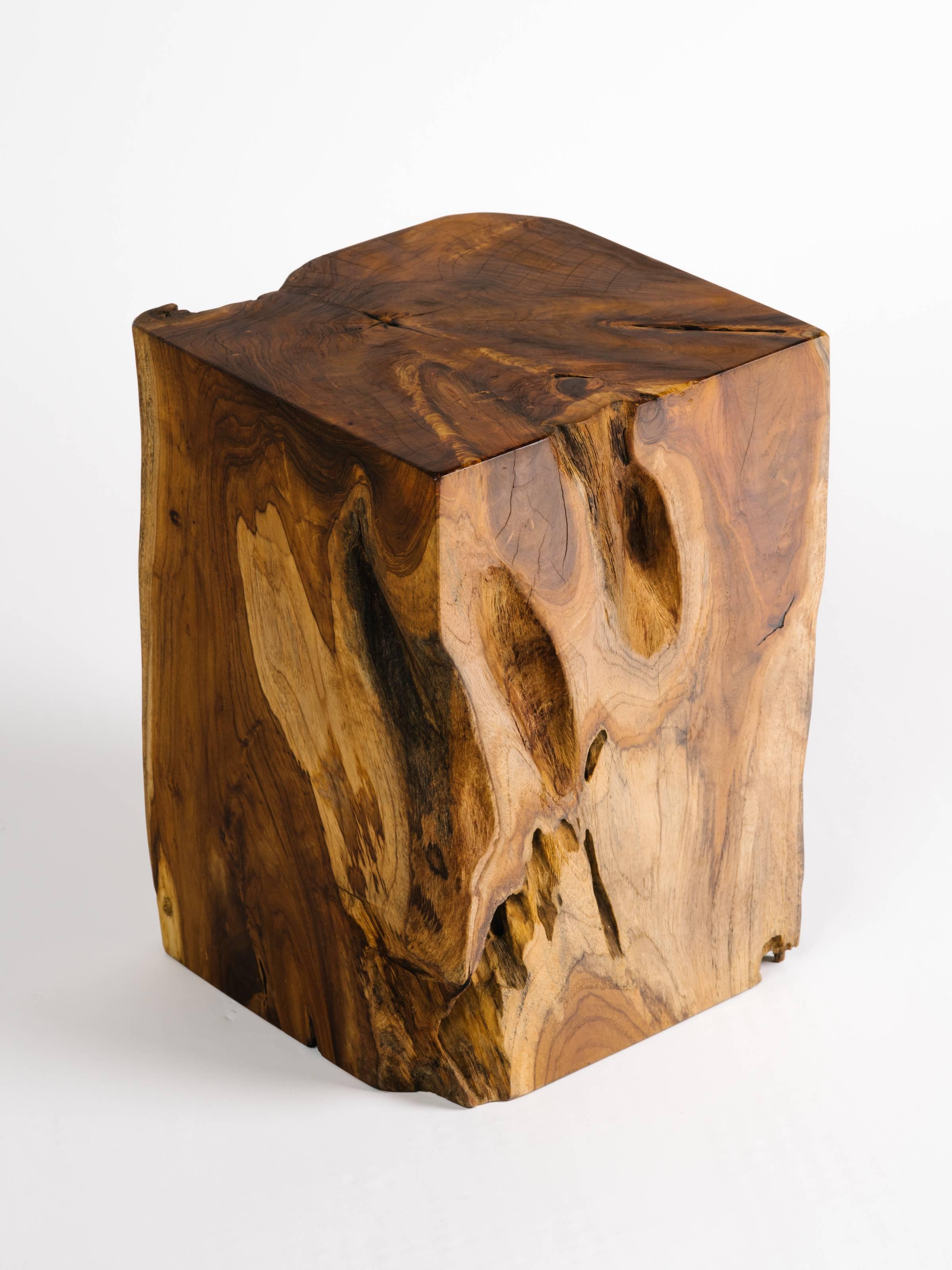 Organic modern cube side table or drink table made of teak root wood. Natural wood coloration and wood variations on all four sides.