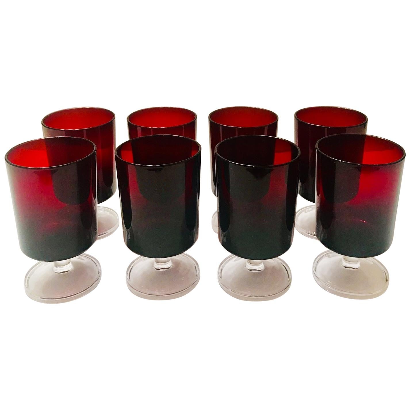 Set of 12 French vintage crystal wine or liquor glasses in jewel tone red with clear glass stems. Glasses have Minimalist design with cylinder forms. Stamped 