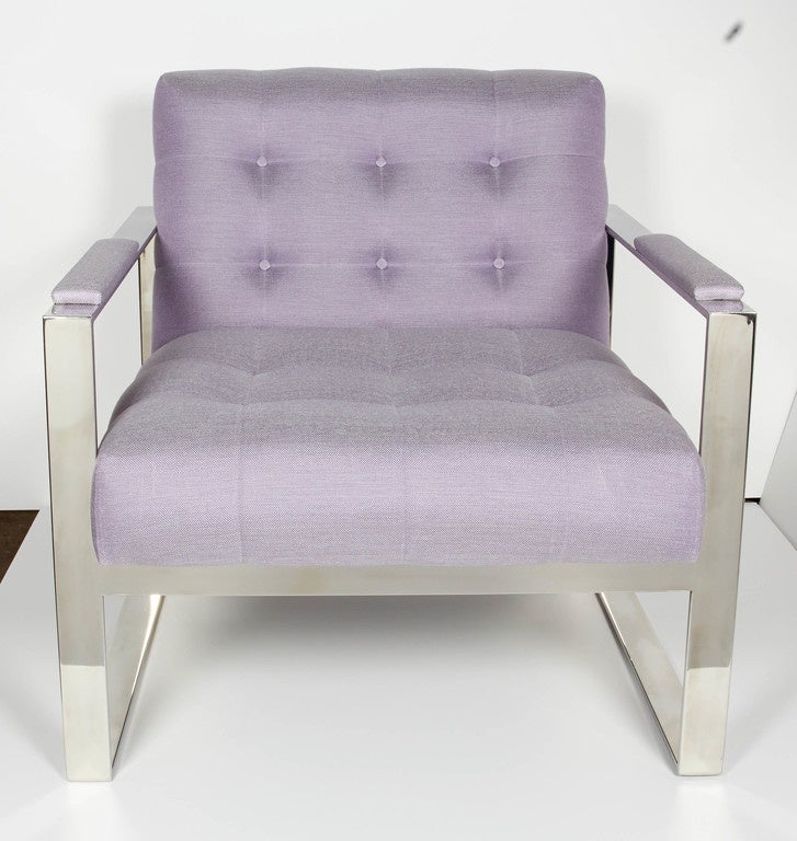Pair of outstanding glamorous lounge chairs. The chairs feature a modern cantilevered steel frame design in a polished chrome finish. Newly upholstered in a chic lavender fabric with woven details. The back and seat have a spectacular biscuit tufted