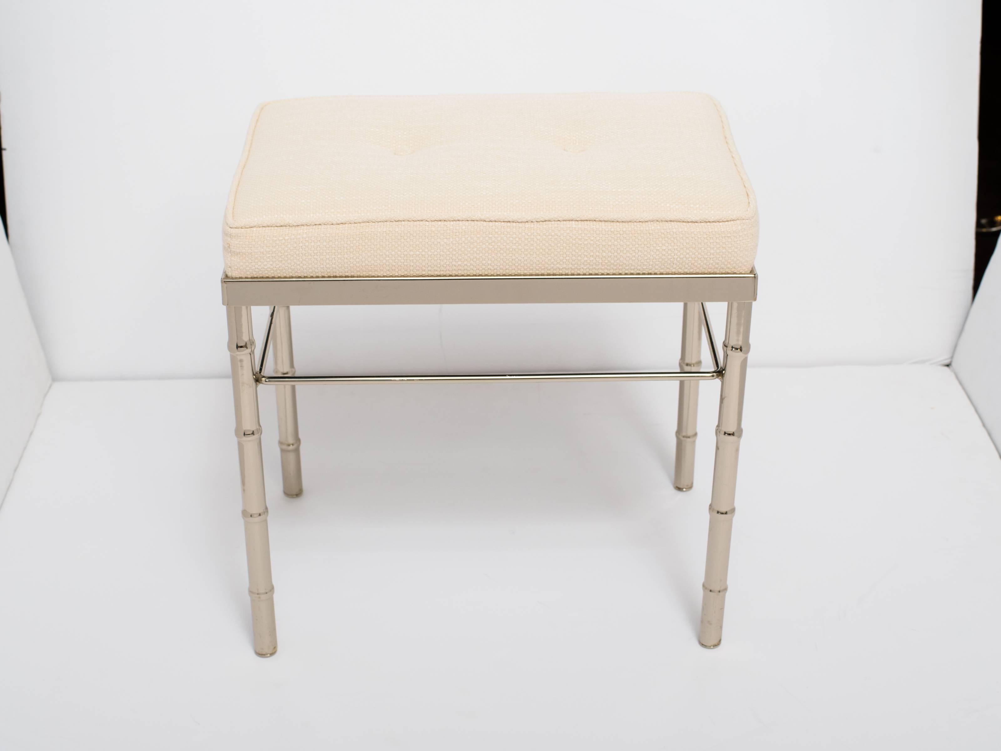 Elegant vanity stool or petite bench with bamboo motif. Polished chrome base or frame with newly upholstered seat in woven ivory. Features two button accents and self welt details. Perfect scale for vanity or dressing table.