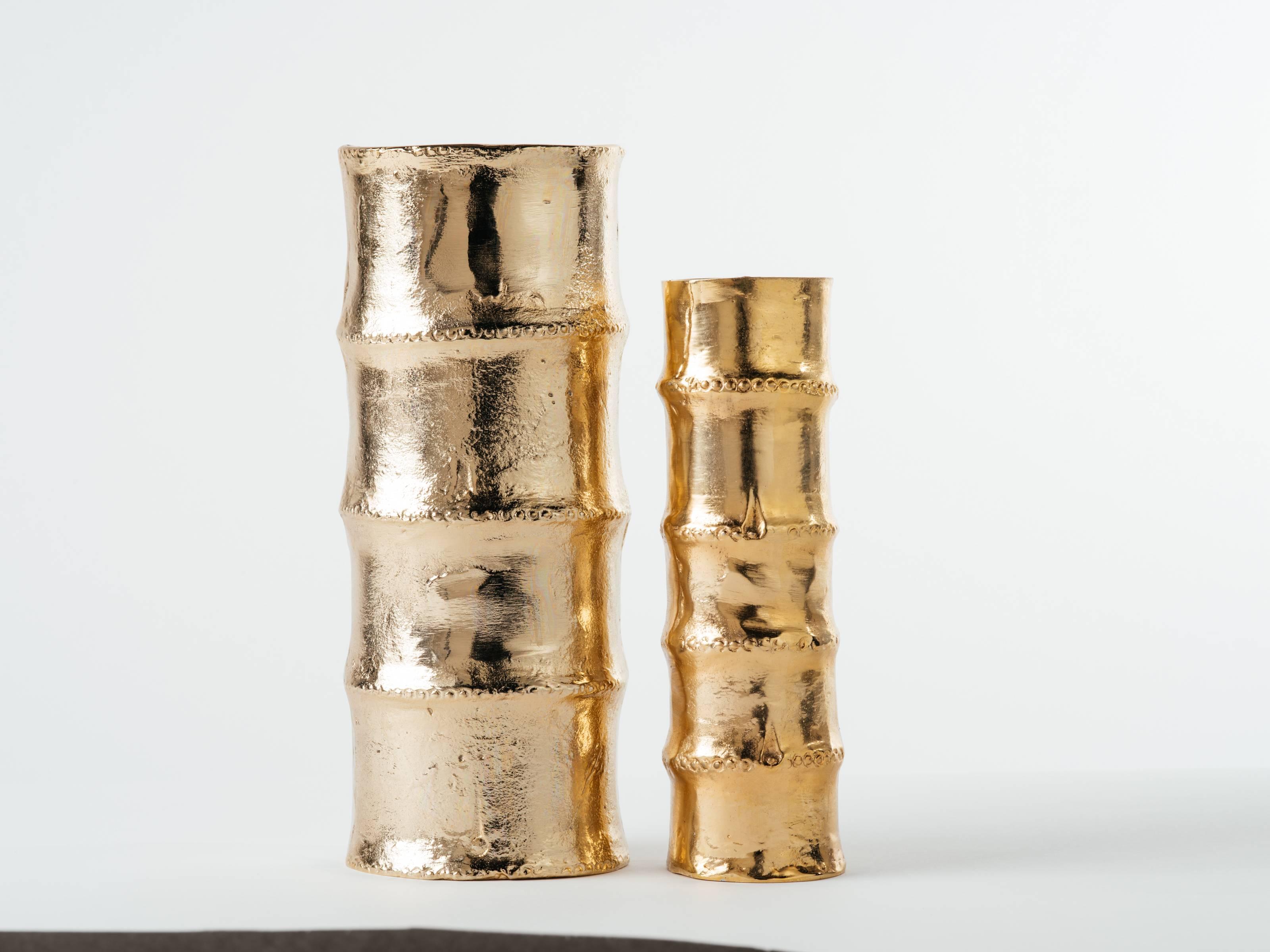 Exquisite pair of Mid-Century Modern style sand cast bamboo vases. 24-karat gold plating over metal alloy, or cast iron. Large vase measures 12