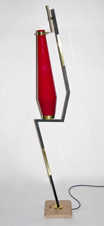 A very rare Italian floor lamp attributed to Stilnovo of unique modern design, the red blown murano glass shade attributed to Vistosi, overlaid in white to intensify the light, has an enticing conical shape and is supported by a black lacquered and