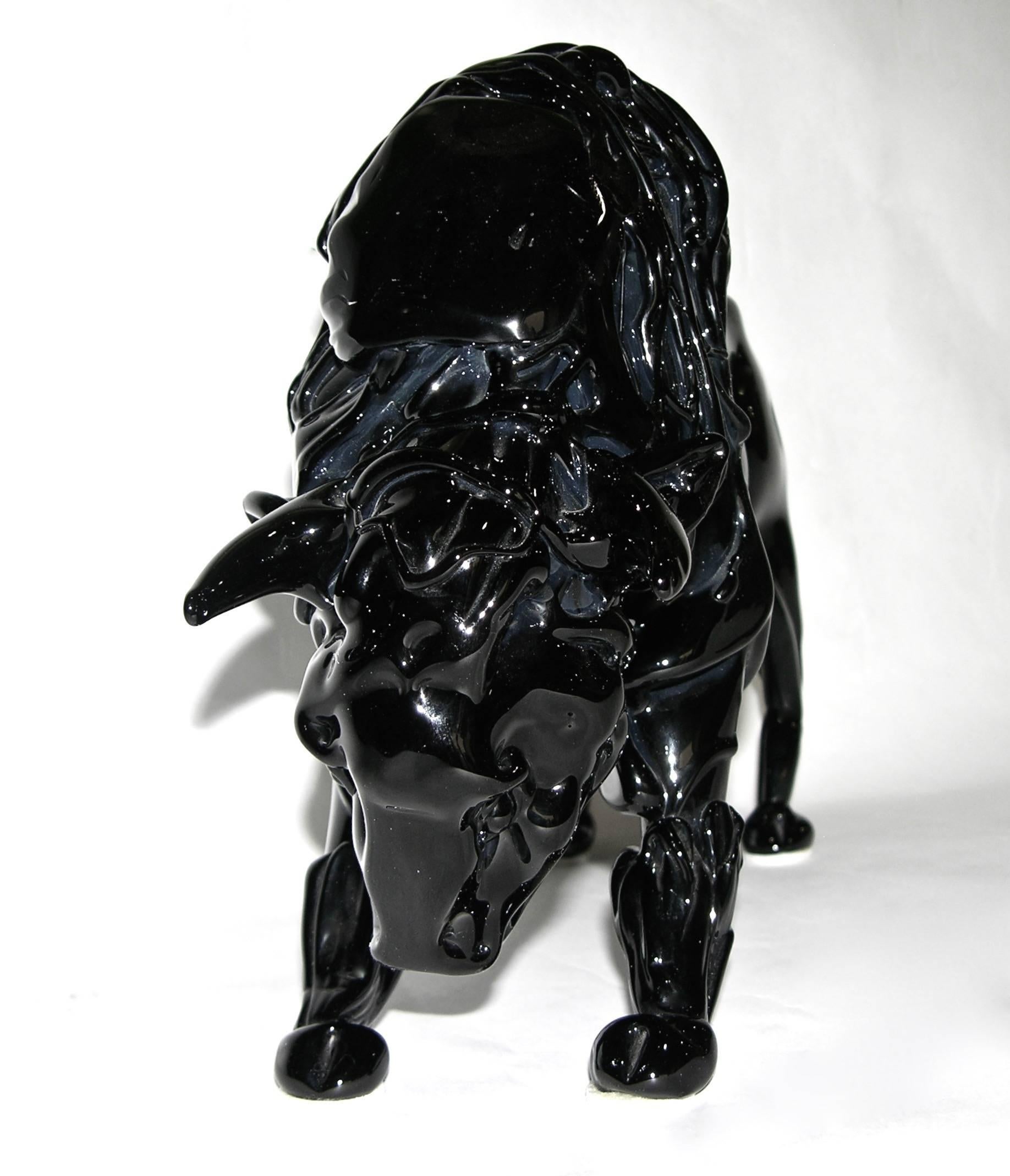 A modern work of art in deep black Murano glass, a grand-size buffalo with arched back blown and handcrafted with Maestria, attributed to Romano Dona', excellent craftsmanship, the animal defined with muscles in the body and the extensive fur