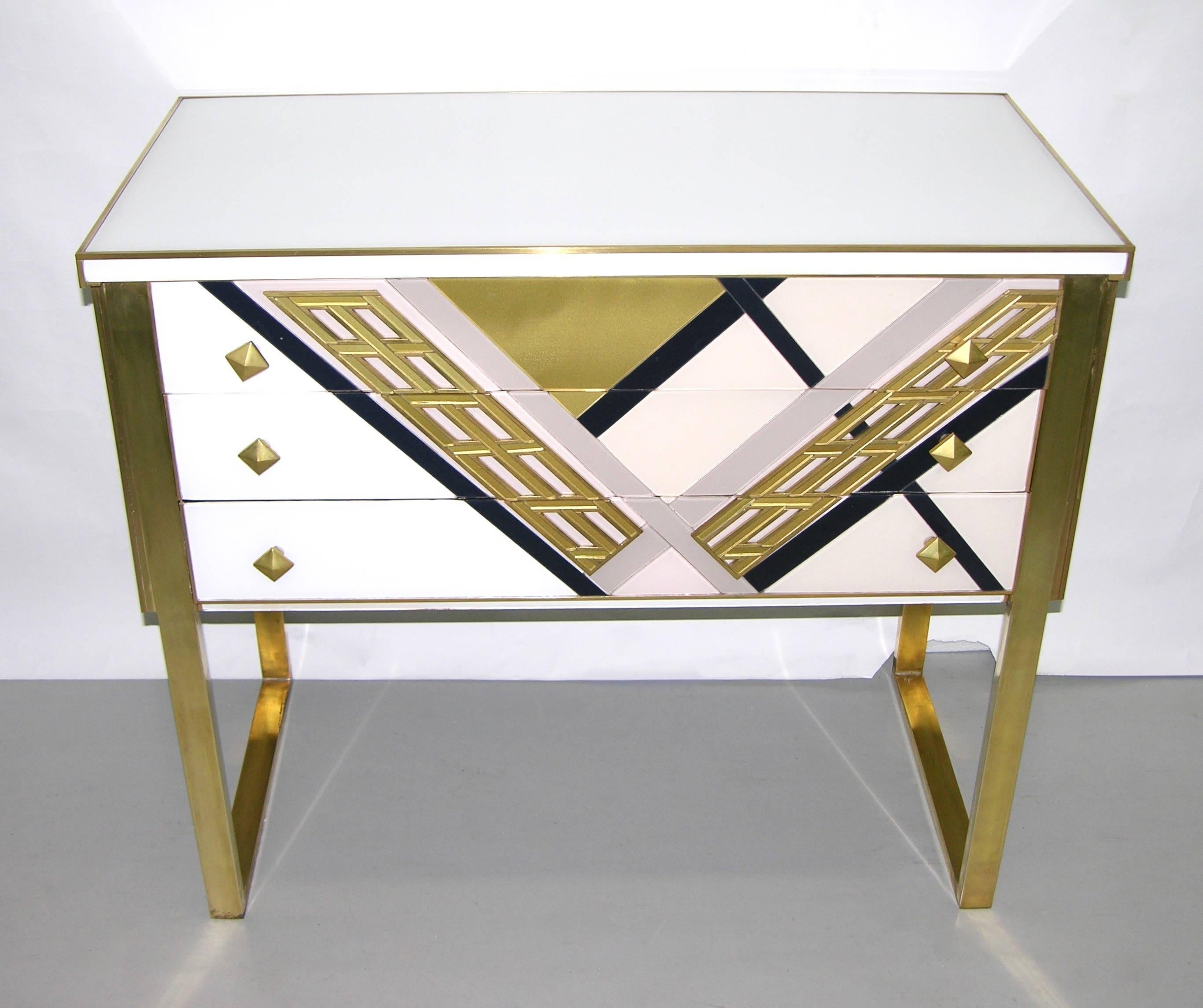 One of a kind modern three-drawer sideboard or console, entirely handmade in Italy, very attractive design, the surround in ivory white glass is also finished at the back so that this piece can stand in the middle of the room, the front decorated