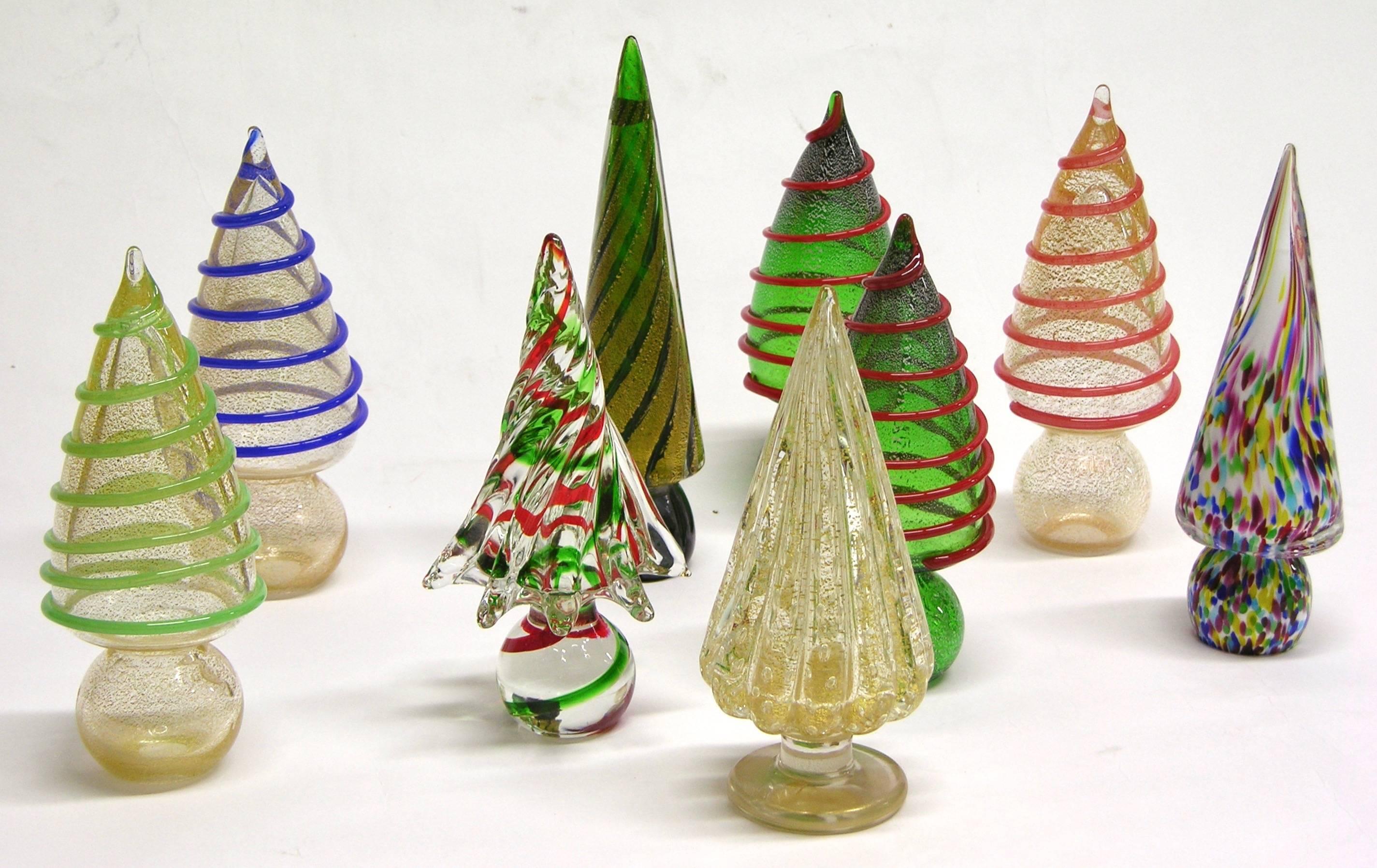 These colorful Christmas Trees are each individually blown and a creation by the Venetian Company Formia, in mouth blown Murano glass, each worked with a different technique, with Murrine, pure gold in the glass, with inclamo and speckles, with