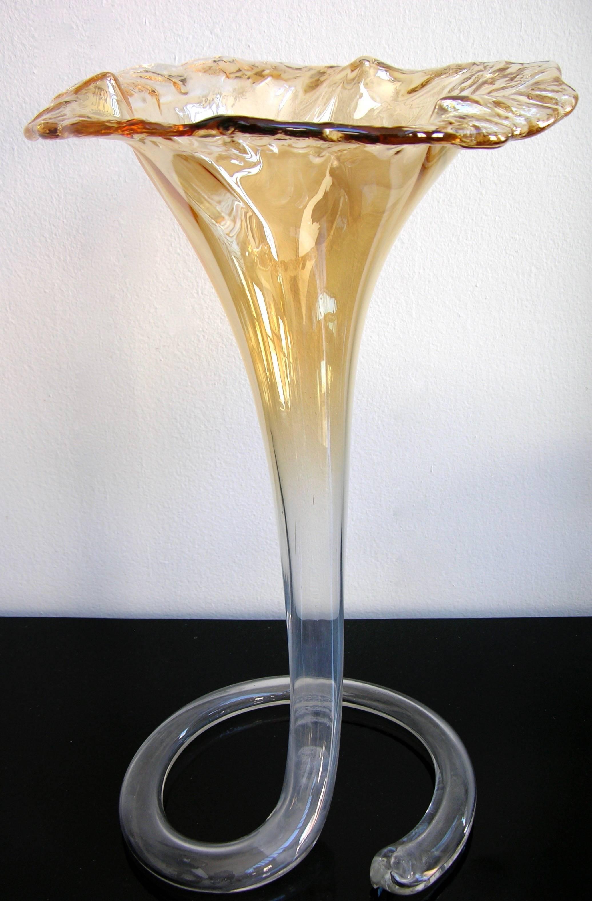 Antique Italian mouth blown masterpiece Murano vase from the first part of the 20th century, elegantly shaped in the form of a blooming lily. With its fluid, sculptural lines and ruffled edge, the piece radiates both delicacy and technical mastery.