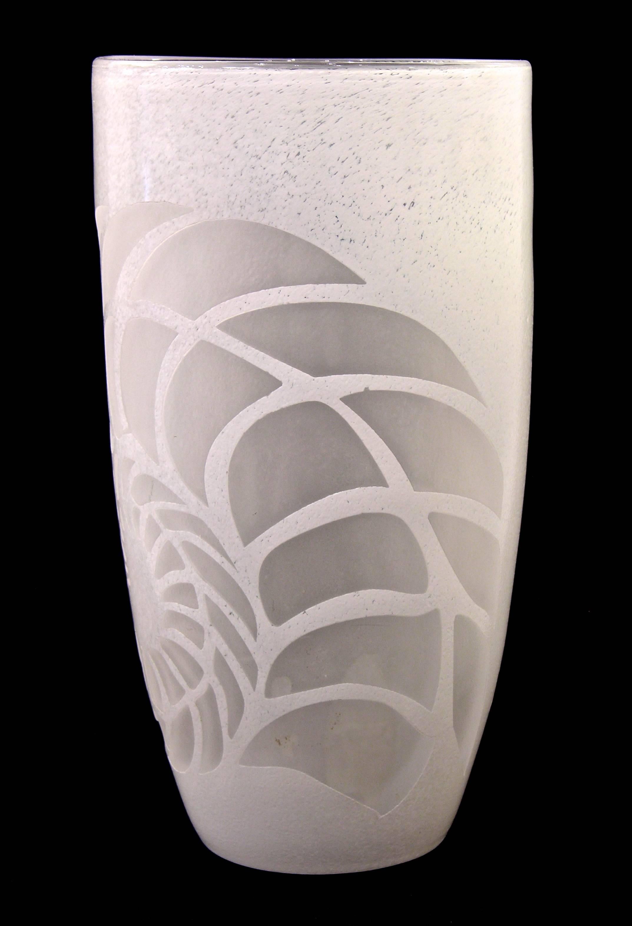 Late 20th century blown Murano glass vase, clear glass overlaid in textured white to enhance the clear decoration of stylized ferns. 
Unclear signature.
 