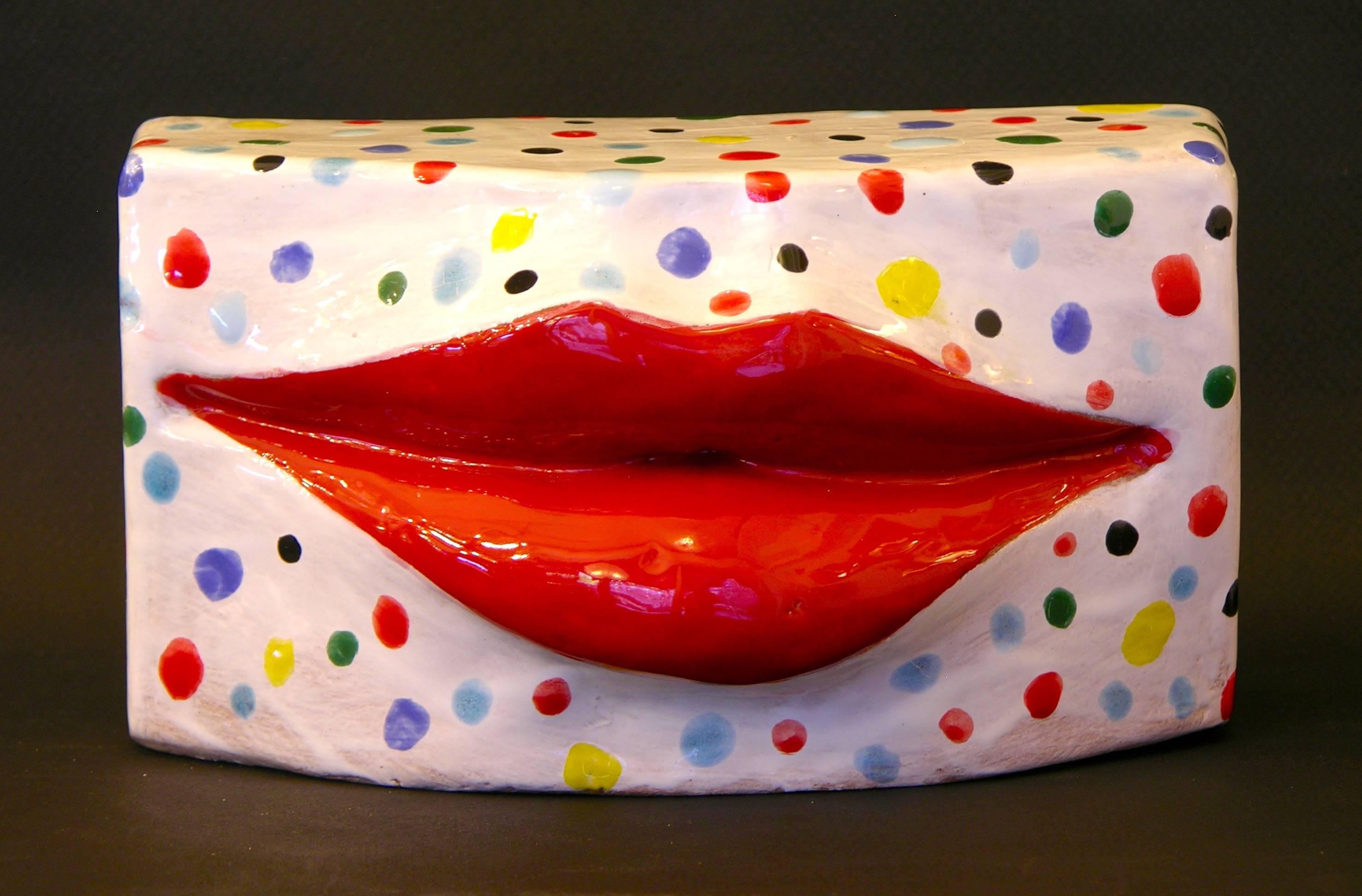Contemporary Art Sculpture in terracotta, handcrafted with fired enameled red lips, so realistic it looks like they are wearing true lipstick, the white background is triple fired enameled with multi-color dots.
A very interesting Work of Art,