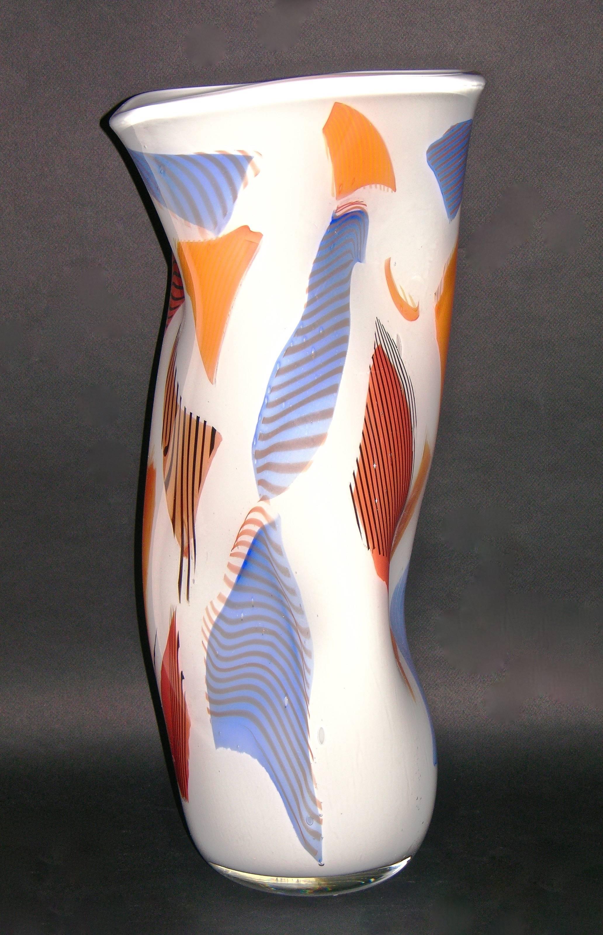 Italian vases, contemporary work of art signed by Davide Dona' in blown Murano Art glass. These striking ivory white vases are beautifully worked with Murrine in orange, blue and red tones, highlighted with black accents. The shape is unusual in its