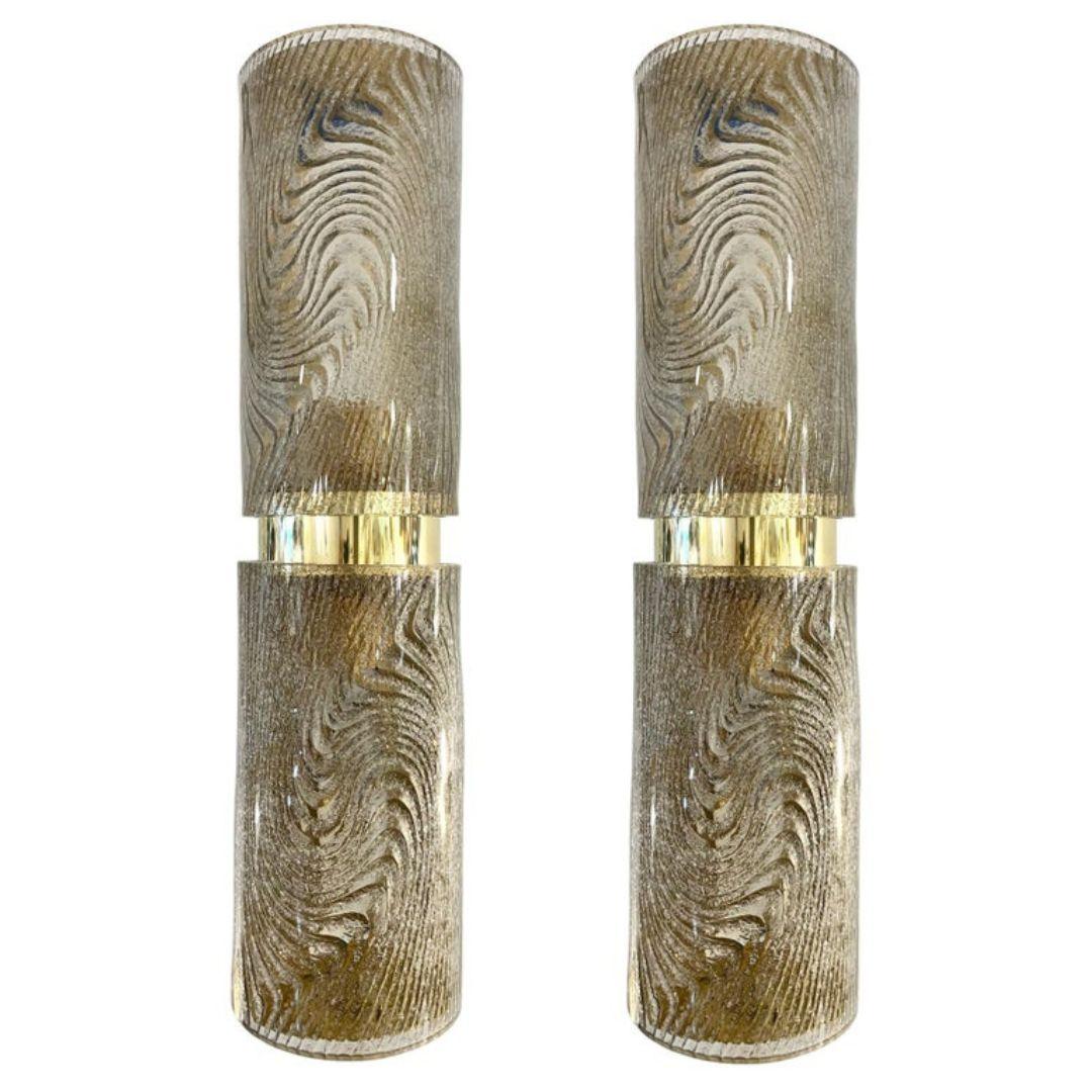 Contemporary Italian Design pair of organic wall lights mounted on a handmade brass structure with two Murano glass cylinders, in a sophisticated light terracotta / brown smoked tint, elegantly decorated on reserve with an attractive swirling