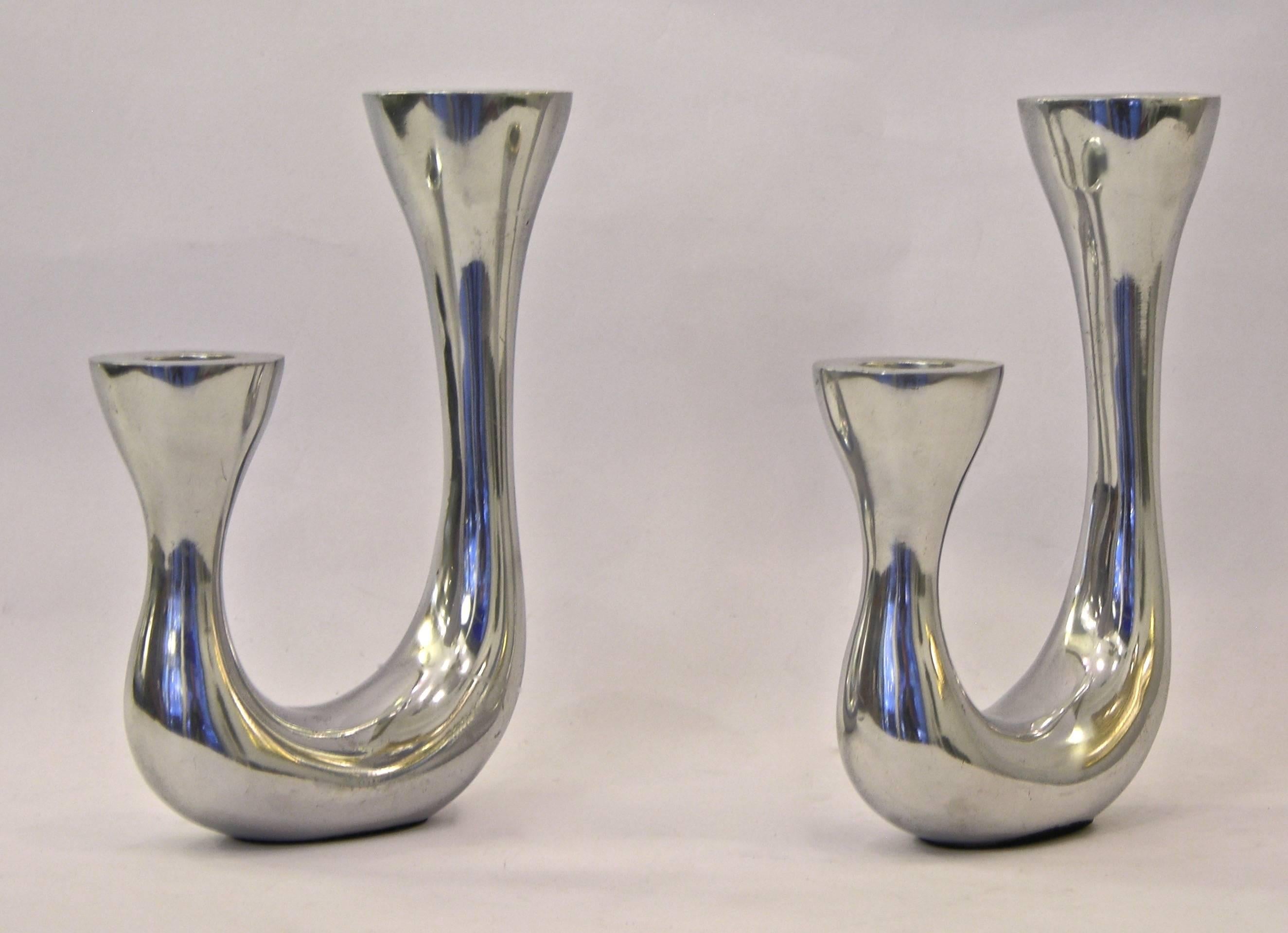 A whimsical pair of Italian candle holders of Modern Design in handcrafted cast aluminum with a polished finish, a great stylish addition to any dining table and entertaining setting.
 