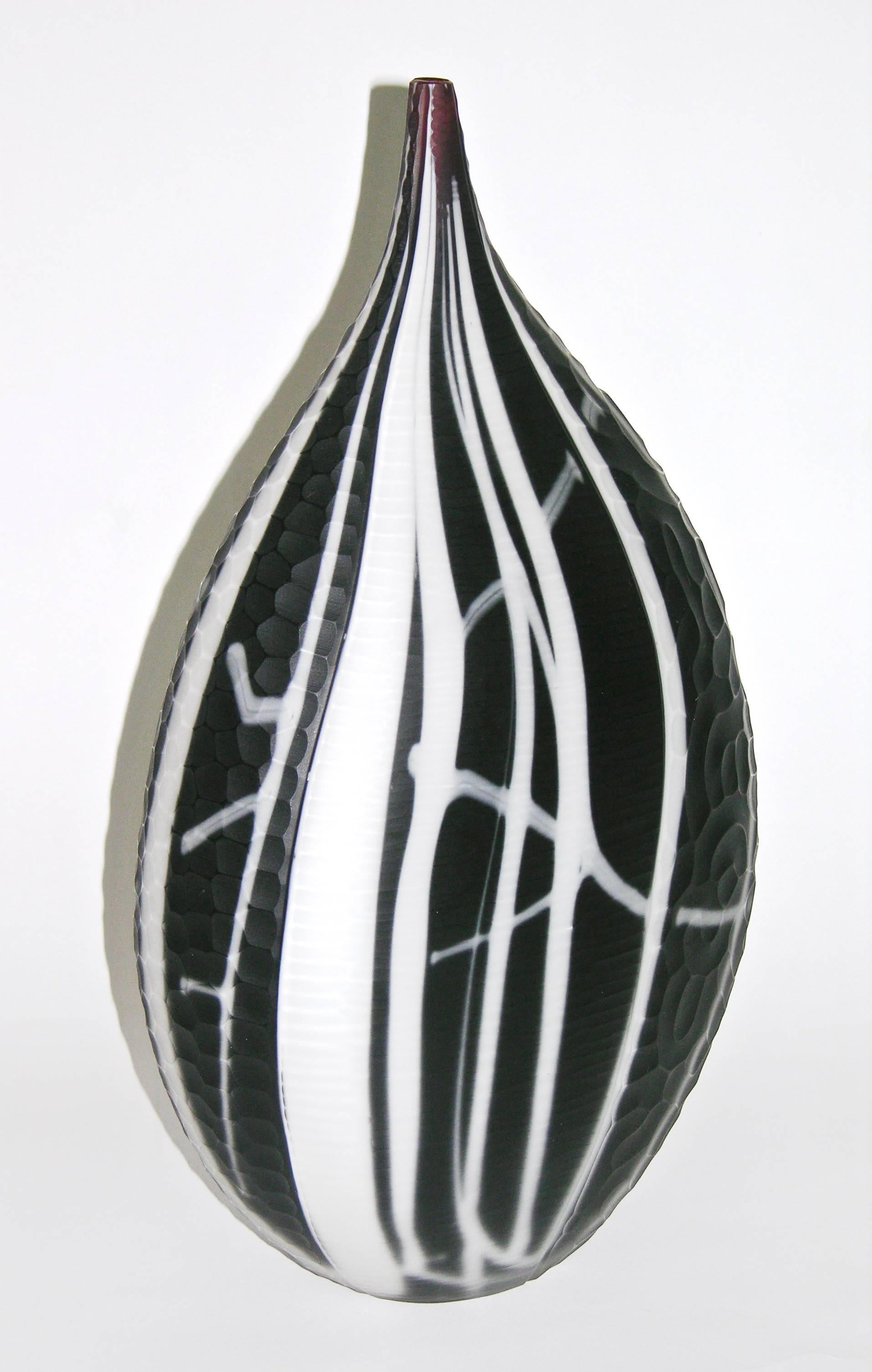 Exceptional vintage work of art by Alberto Dona, a sculpture vase of such superb color: A rare purple opaque blown Murano glass so deep it looks black enhanced with white Murrine worked in a free-form lined pattern to resemble a modern painting, the