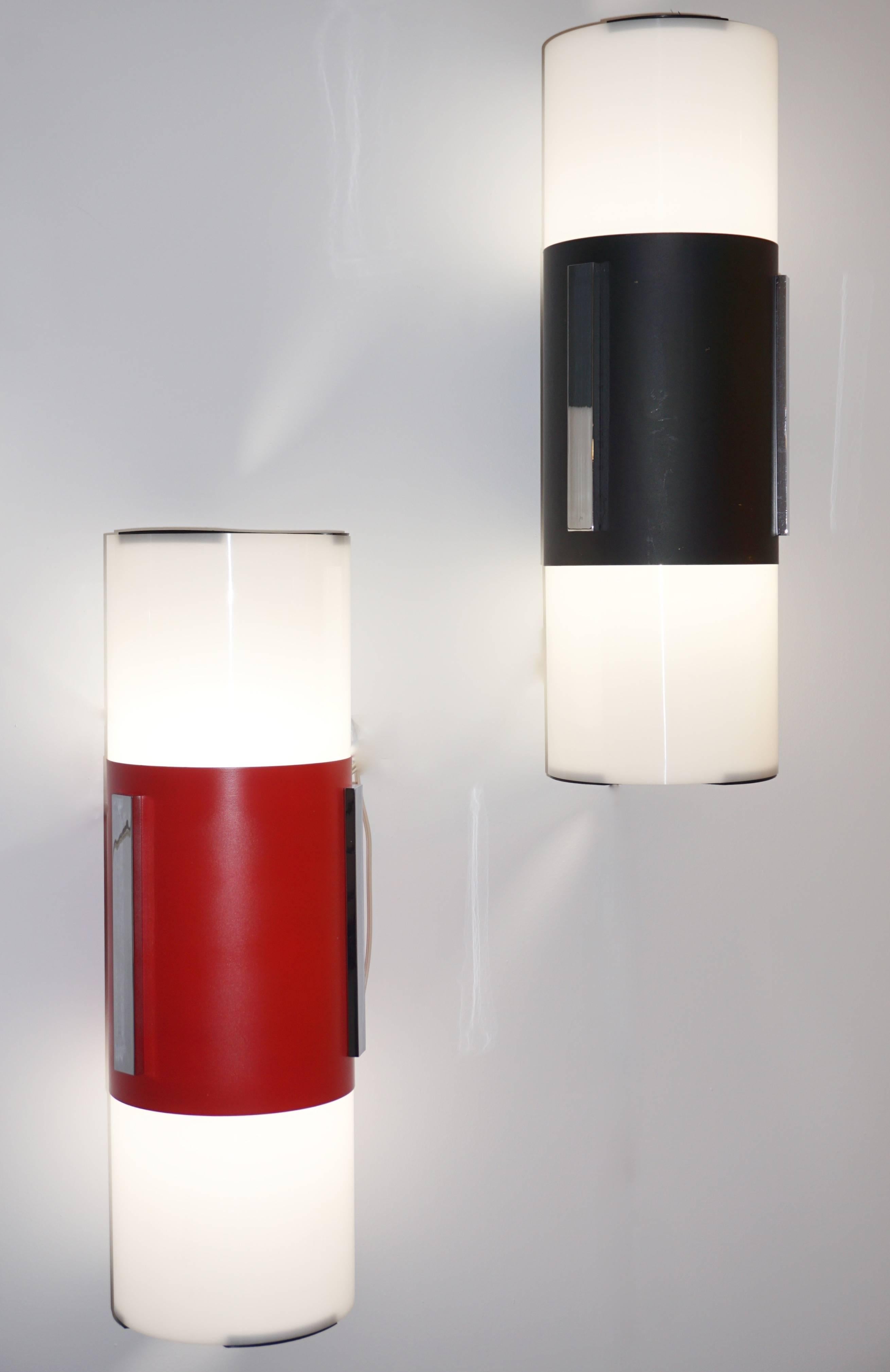 Four pairs in different colors available - 1960s Italian Mid-Century Modern pair of solid plexiglass sconces / flush mount lights with Minimalist Design by the company LOM that operated in Monza, near Milan and closed in 1990. The execution is of