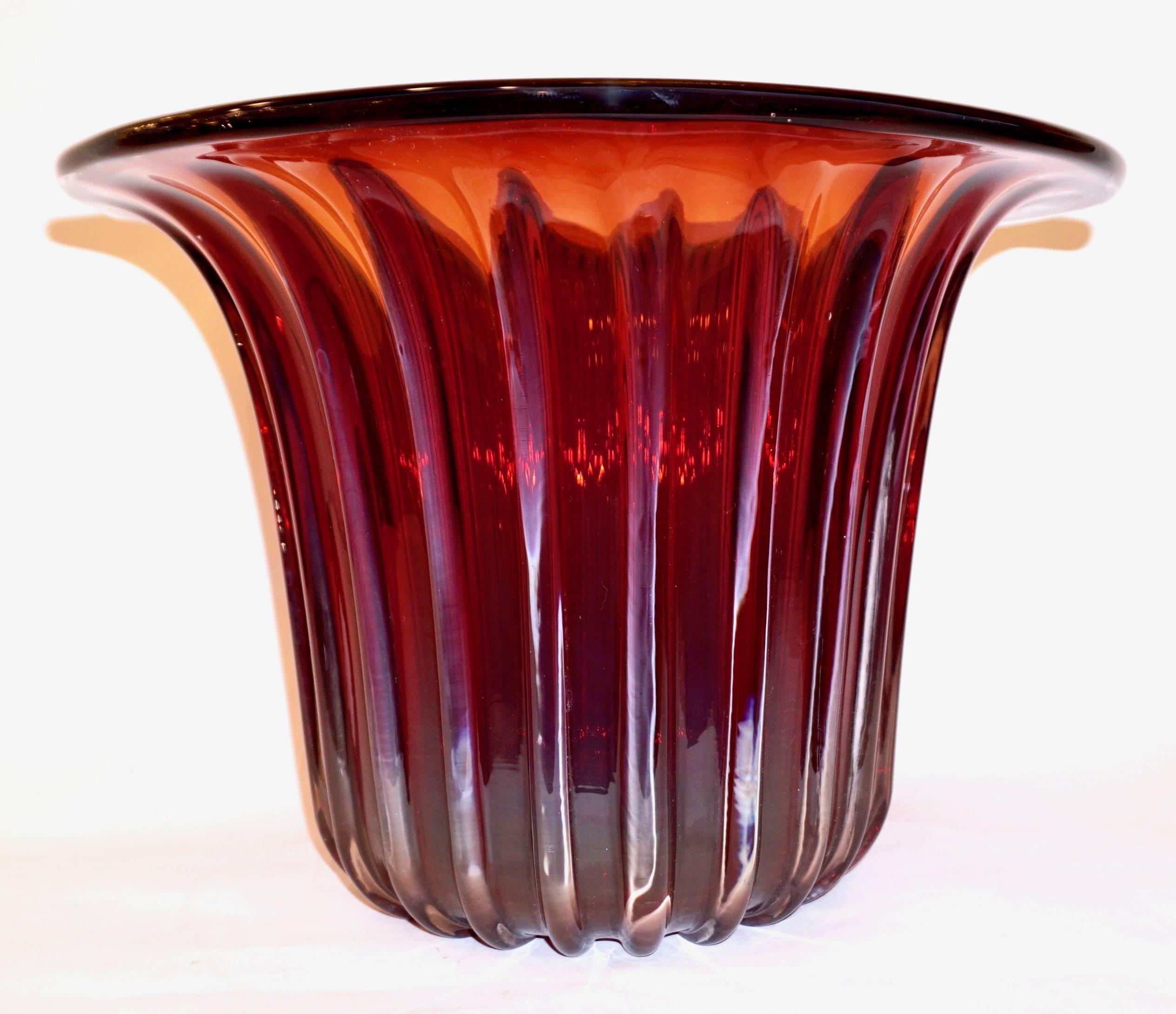 A striking pair of artistic blown Murano glass vases or bowls, imposing for their size, signed by Mattia Toso, executed by Pino Signoretto Studio. The cornelian red color is very rich and shows golden orange reflections when hit by a light source,