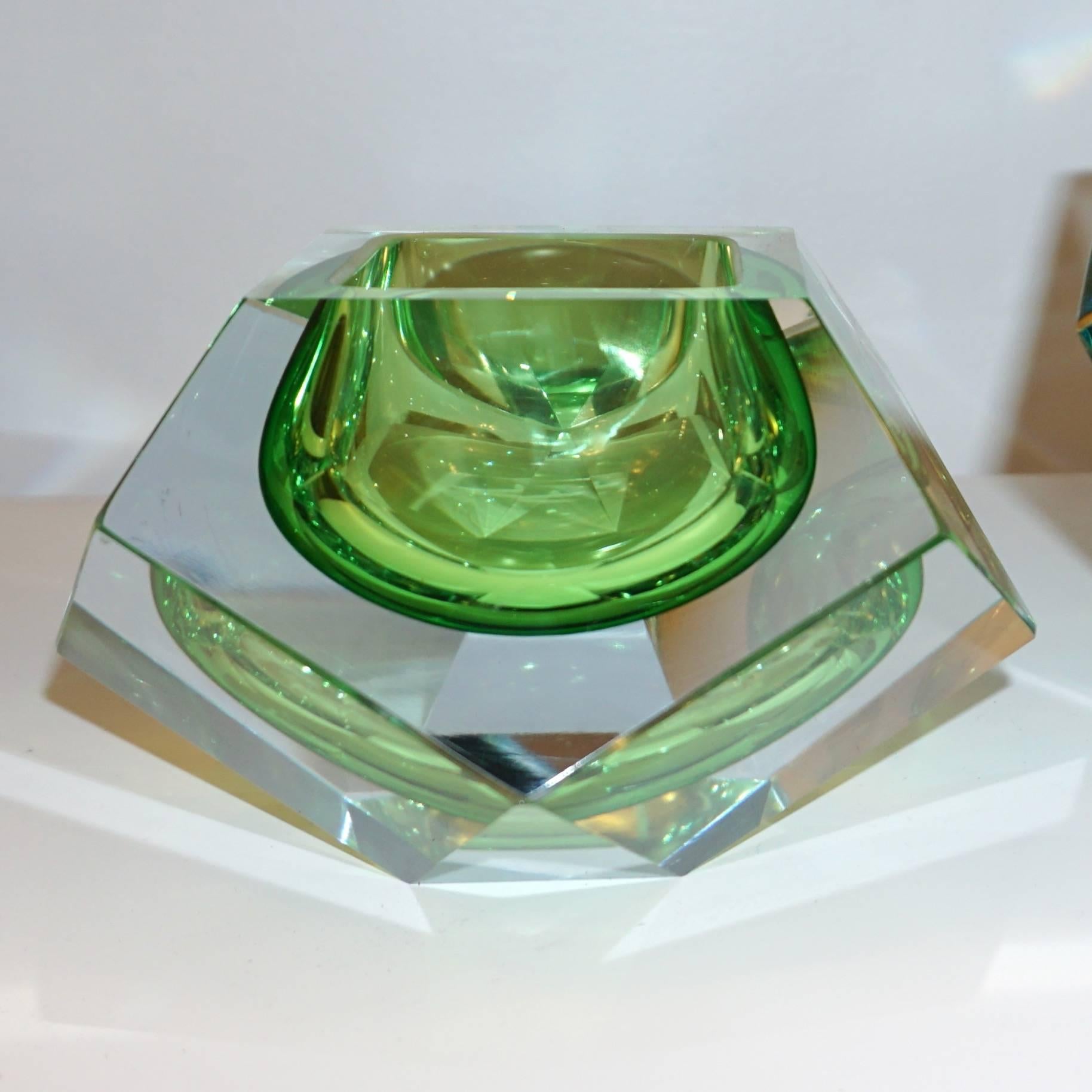 1950s Italian diamond faceted art glass catchall / paperweight of modern design by Seguso in hand-cut Murano glass, a very decorative bowl with a diamond multifaceted exterior which catches the light like a prism. This piece has a flat cut polished