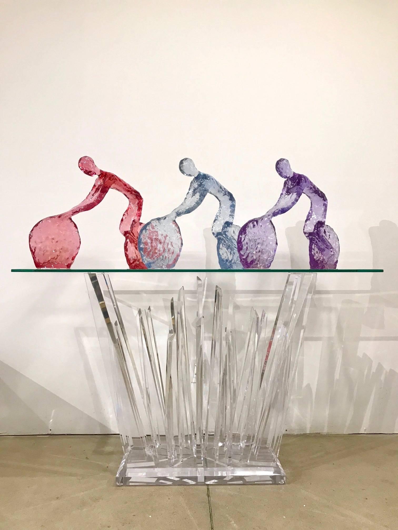 Price is for one sculpture. Contemporary Minimalist biker on bicycle sculptures in high-quality lucent pastel colored acrylic with a textured finish that makes them appear like glassworks of Art, exclusively handcrafted in the USA and curated by a