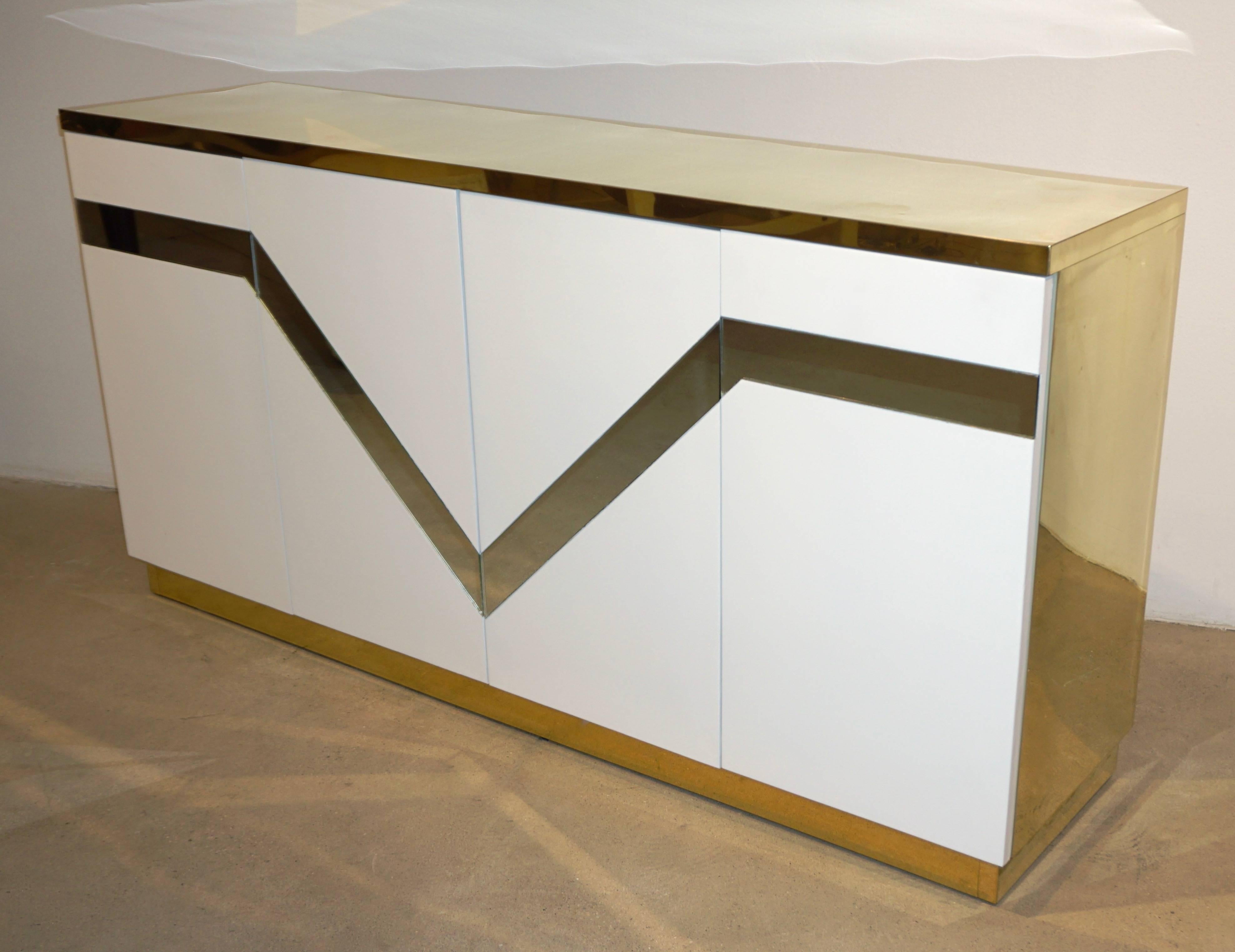A unique Italian modern geometric design for this sideboard / cabinet, with the great advantage of a shallow body, by the Architect Sandro Petti for L' Angolo Metallarte, 1970s, Rome. Characteristic of the work of Sandro Petti is his Haute Couture