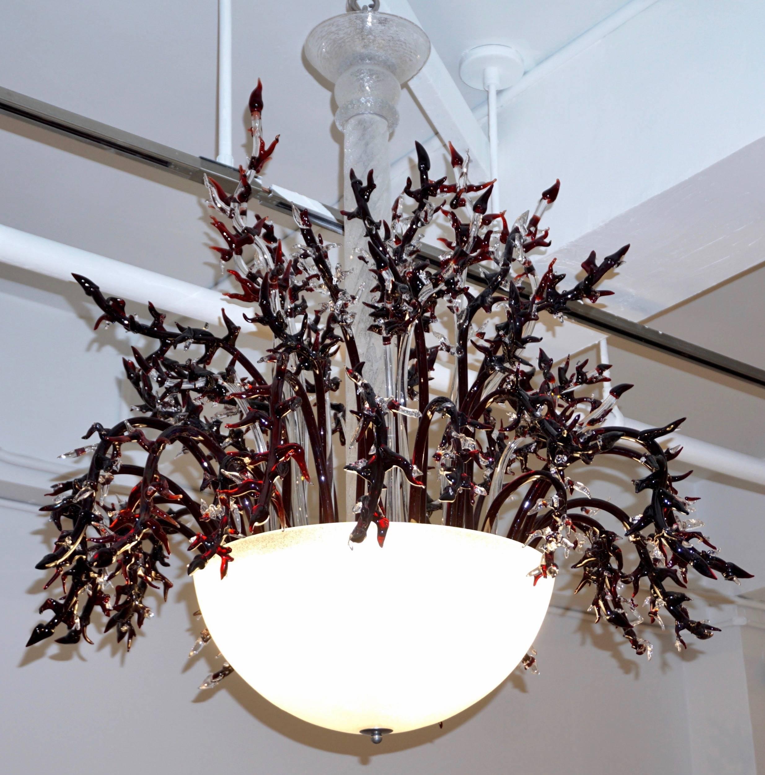 One-of-a-kind vintage Italian Murano glass chandelier of lush design, the frosted white blown Murano glass parts, central pole and half moon bowl are handcrafted with crackled texture giving a precious effect. This is a gem with very rare and