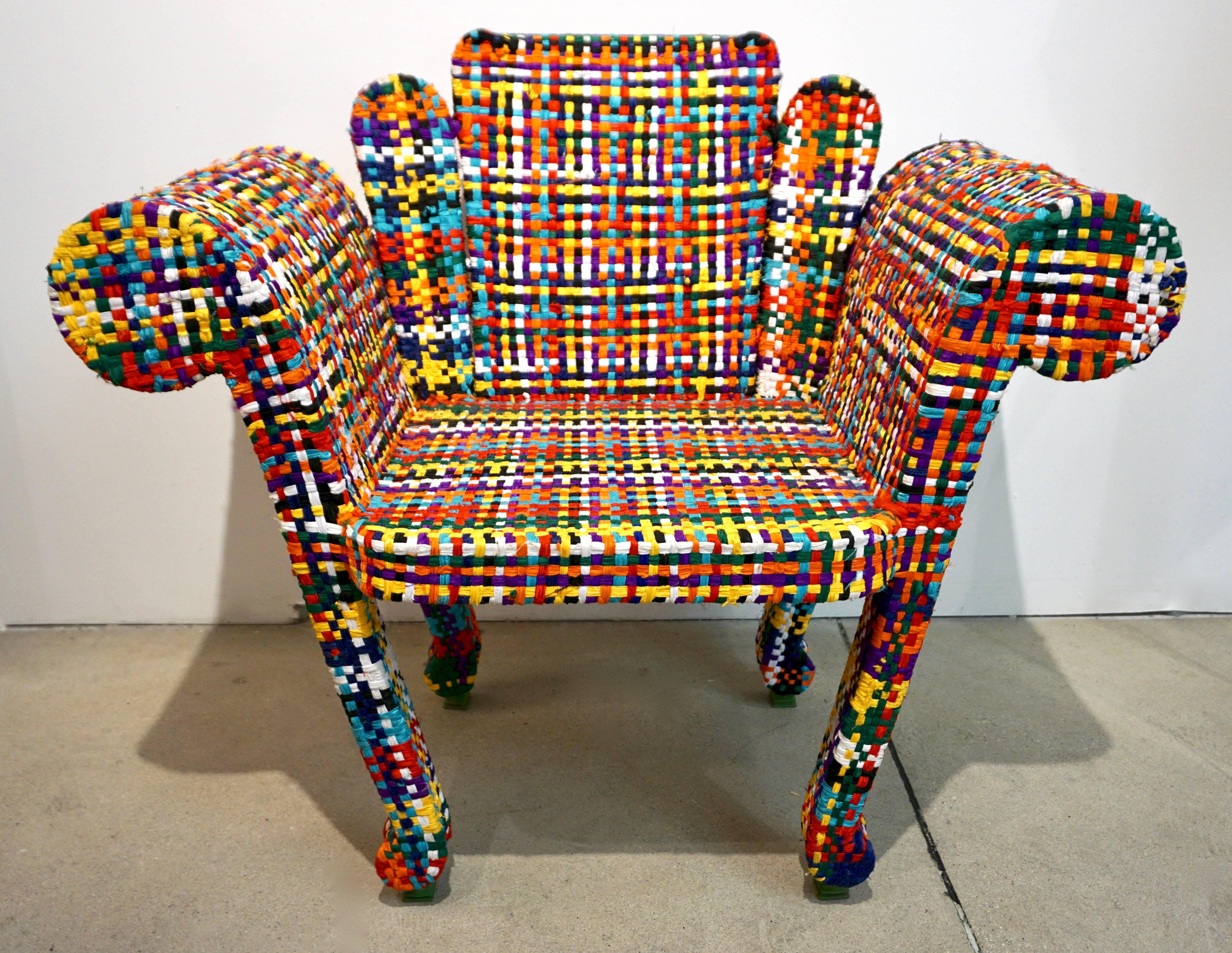 This pair of fun vintage armchairs is a unique modern design manufactured and signed by the Italian artist, Anacleto Spazzapan (Luino, Italy - 1943). The handmade structure is created with hand welded iron tubes and covered with hand weaved colorful