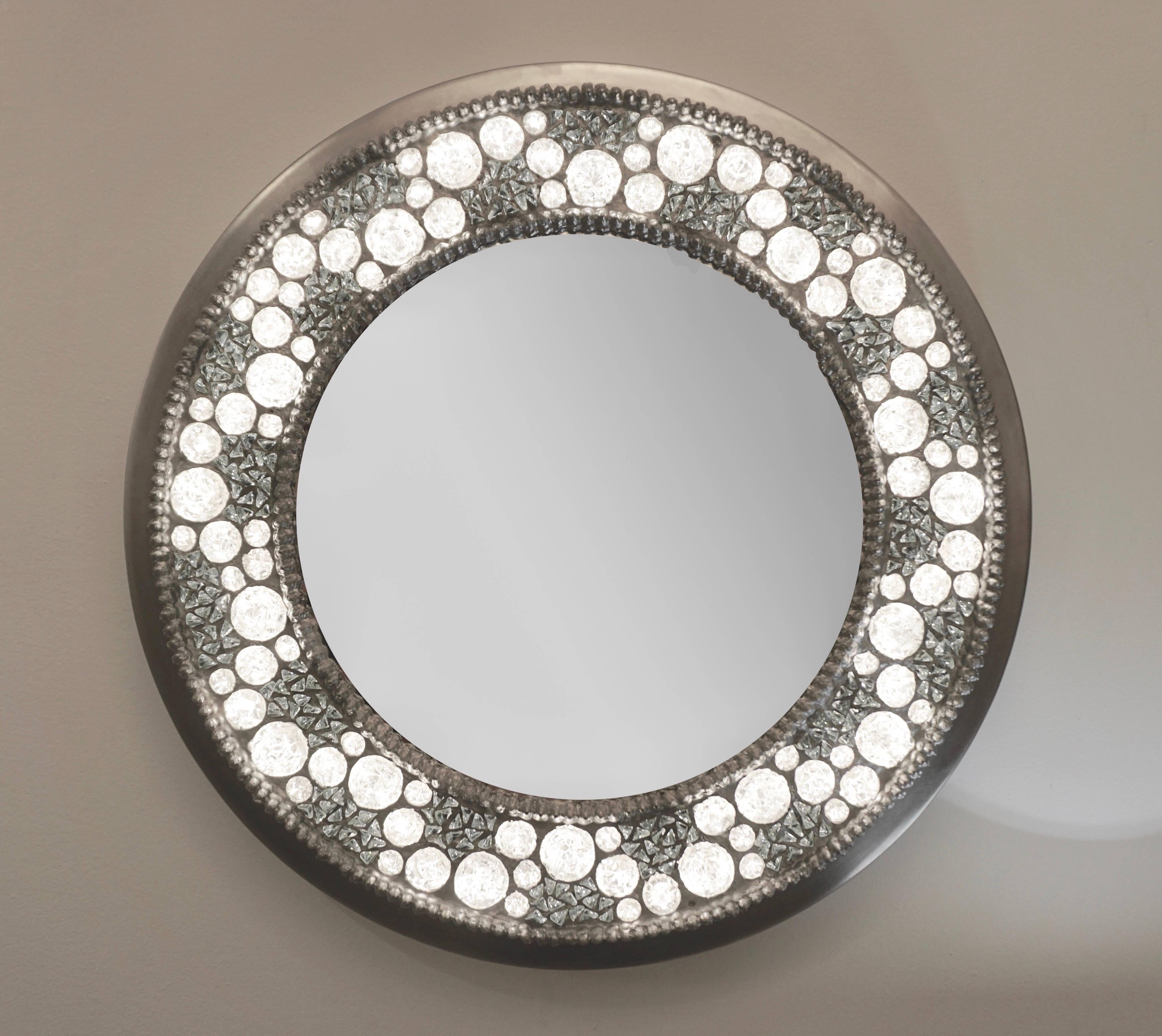A jewel like Italian mirror, Work of Art sculpture, entirely hand crafted. The exterior frame is in hand bent nickel, while the sophisticated decoration is composed of hand cut rock crystal diamond elements of different sizes set in reverse inside a