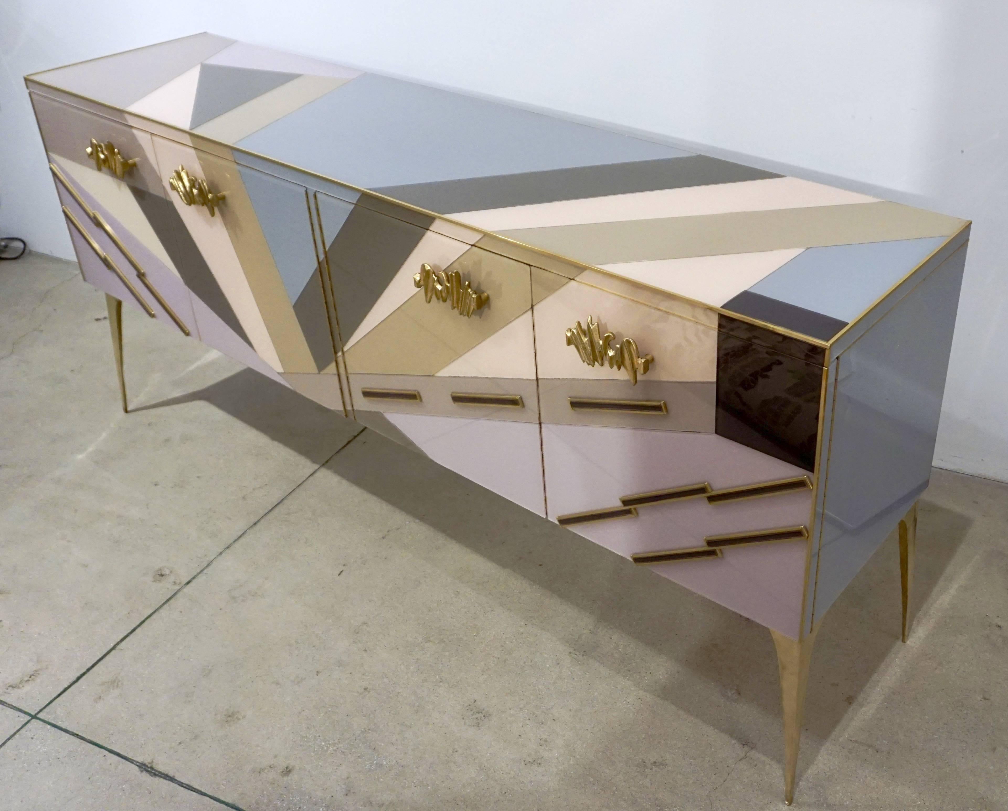 A uniquely interesting piece, very fun contemporary Italian console/cabinet/credenza of colorful fine design with the advantage of a shallow body. The very enticing geometric pop decor is entirely handmade and presents elegant unusual pastel colors