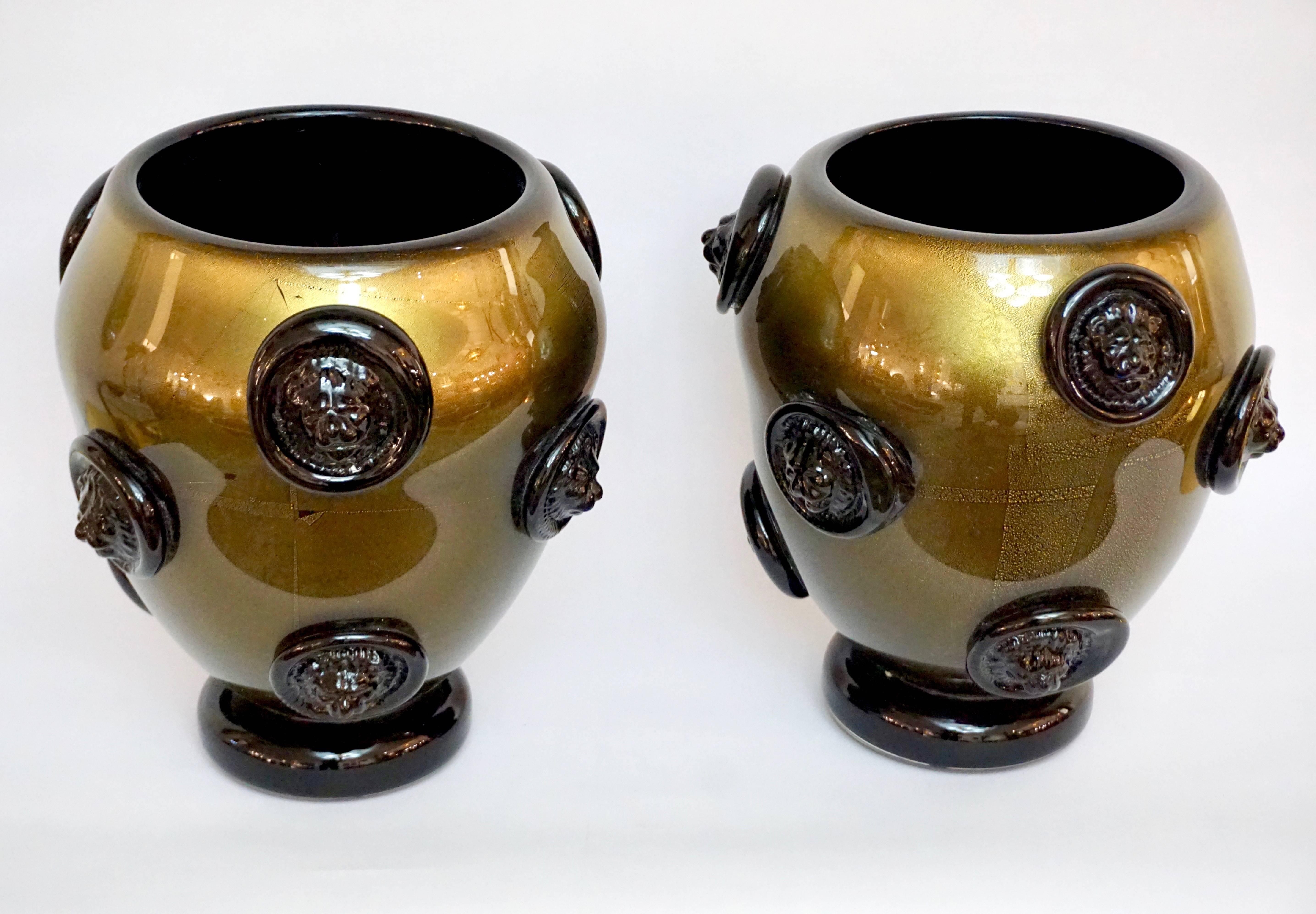 Vintage Italian pair of high quality Art Deco Design Murano glass vases by Cenedese, signed pieces. Exquisite craftsmanship that shows the Maestria of the artist in handling the weight of these blown pieces and for the decor with escutcheons: the