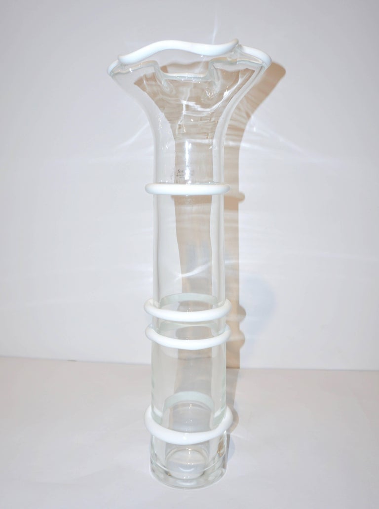 Vintage Italian design monumental vase, tall and slender with flared tops decorated with colored border ad incalmo, in white, high quality of execution with heavy overlaid bottom, in crystal clear blown Murano glass, the organic modern shape
