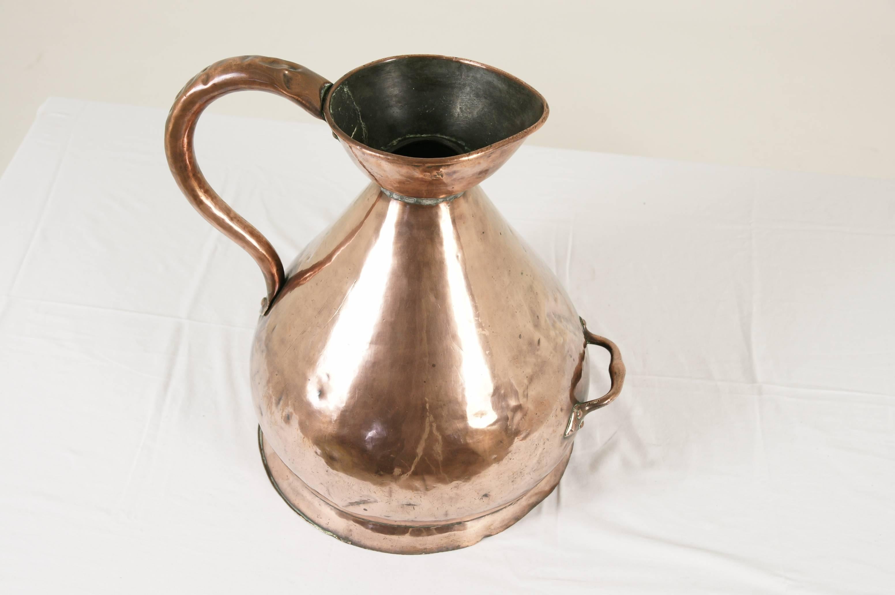 Scotland, 1880.
All original.
Haystack shape.
Wide rounded body.
Shaped pouring spout.
Loop handle.
Has pressed seal mark on inside lip.
Dents and repairs as shown.

$750.

Lot B-202.
Measures: 16