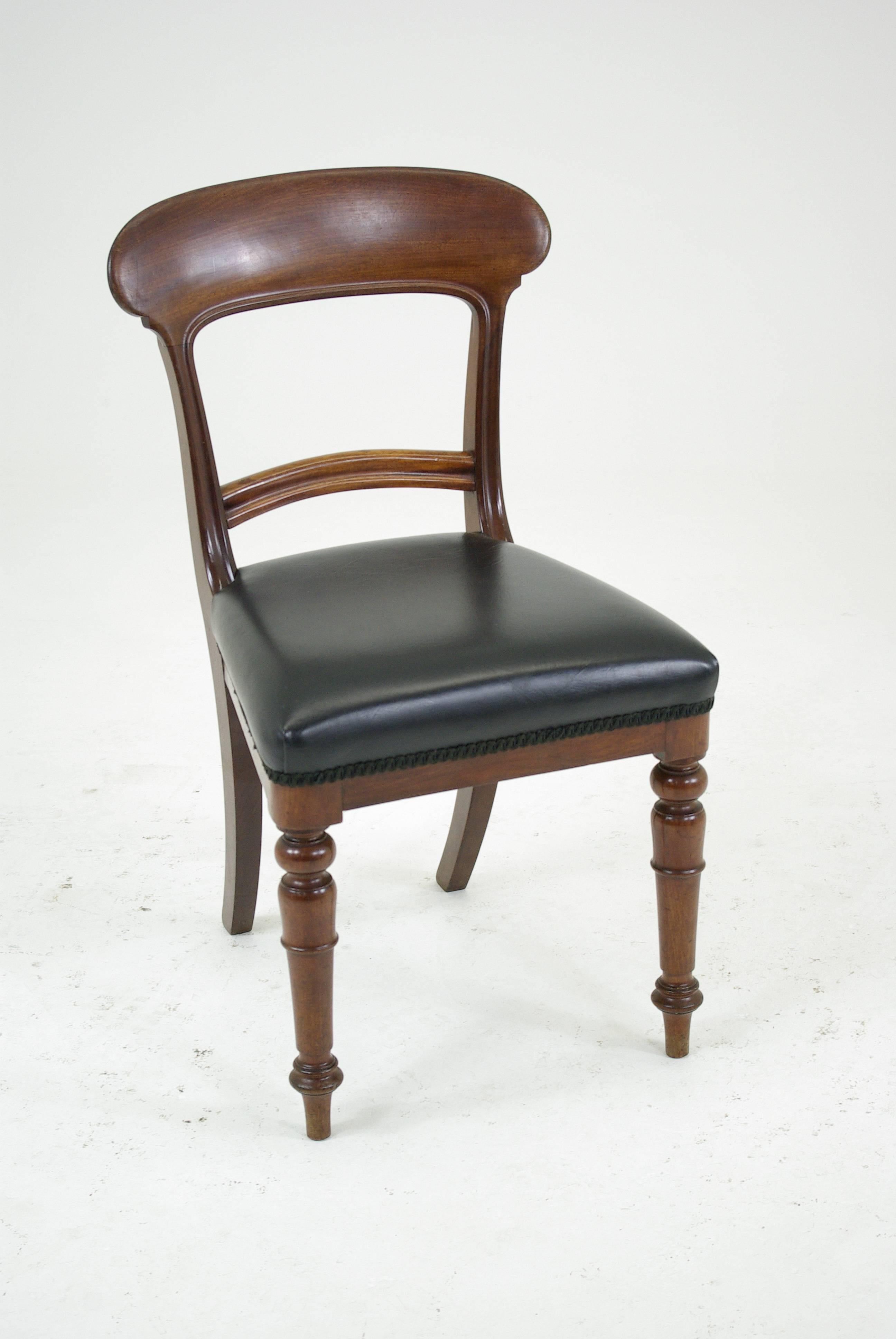 Set of six Victorian mahogany dining chairs with upholstered seats,

Scotland, 1860.
All original finish.
Solid mahogany construction.
Curved top rail.
Shaped center rail.
Upholstered seats (vinyl).
Very comfortable chairs.
Structurally