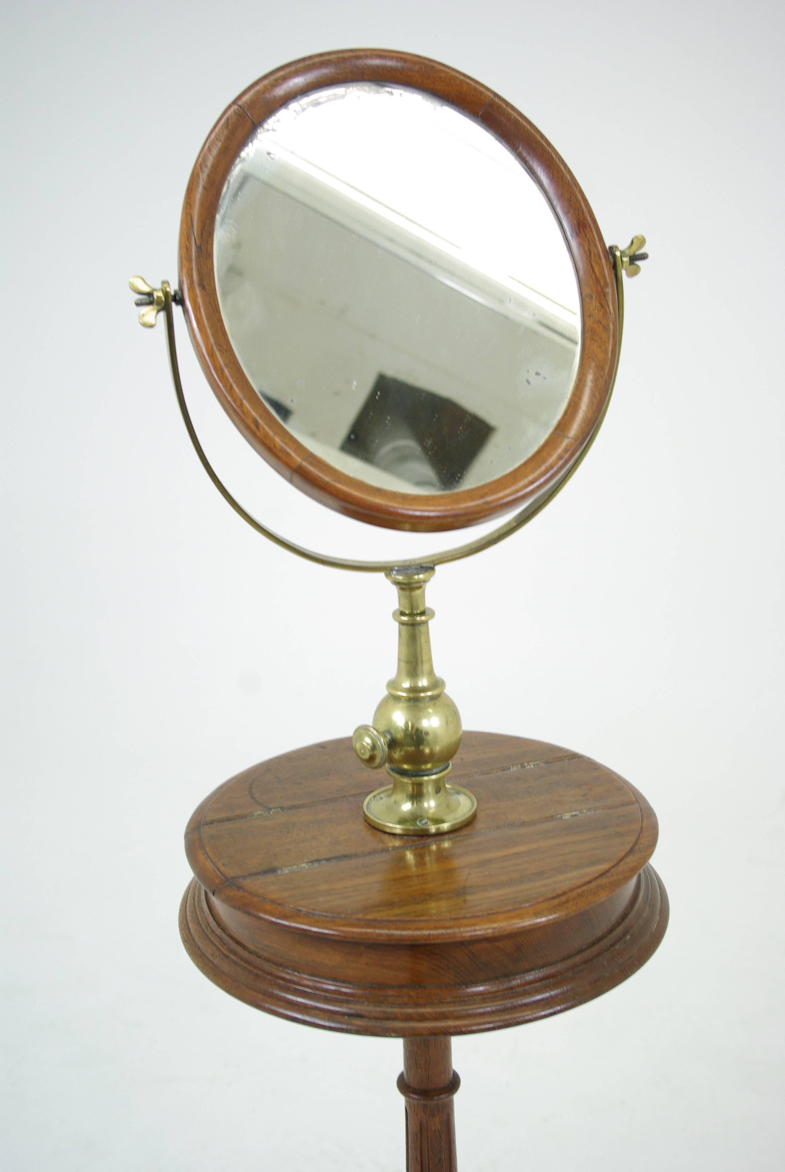 Ant. Scottish Walnut telescopic shaving dressing mirror on carved tripod base.

 Scotland, 1870.
 All original finish.
 Solid Walnut
 All brass fittings are original.
 Wonderful carved base.
 Lovely warm patina.
 Mirror works well.
 Hard to find